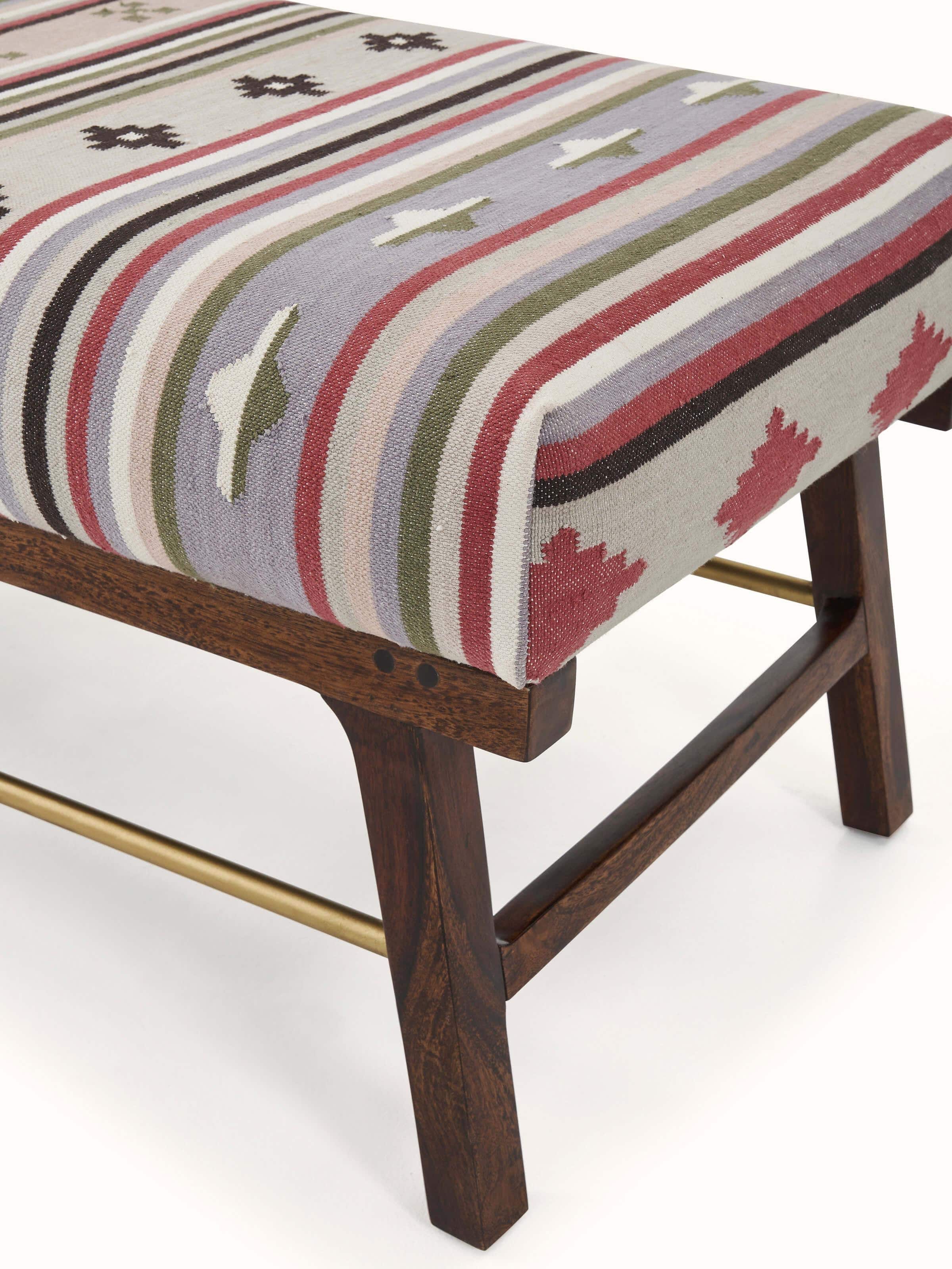 Detailed view of the Panja Dhurrie upholstered Sheesham wood bench, highlighting the quality of the wood and fabric