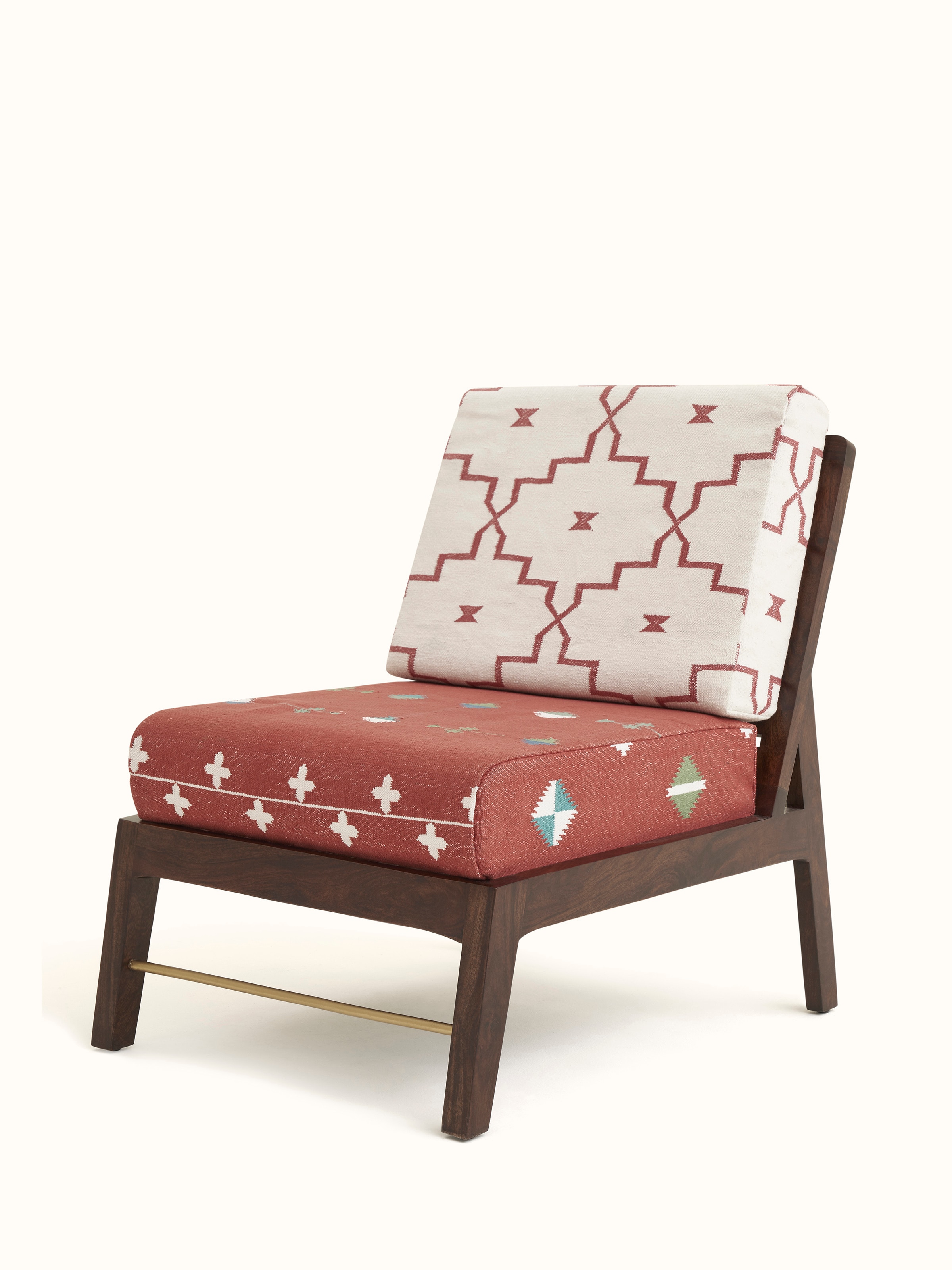 Angled view of Panja Dhurrie Upholstered Sheesham Wood Lounge Chair, showcasing the intricate detailing of the Dhurrie fabric and solid wood structure.