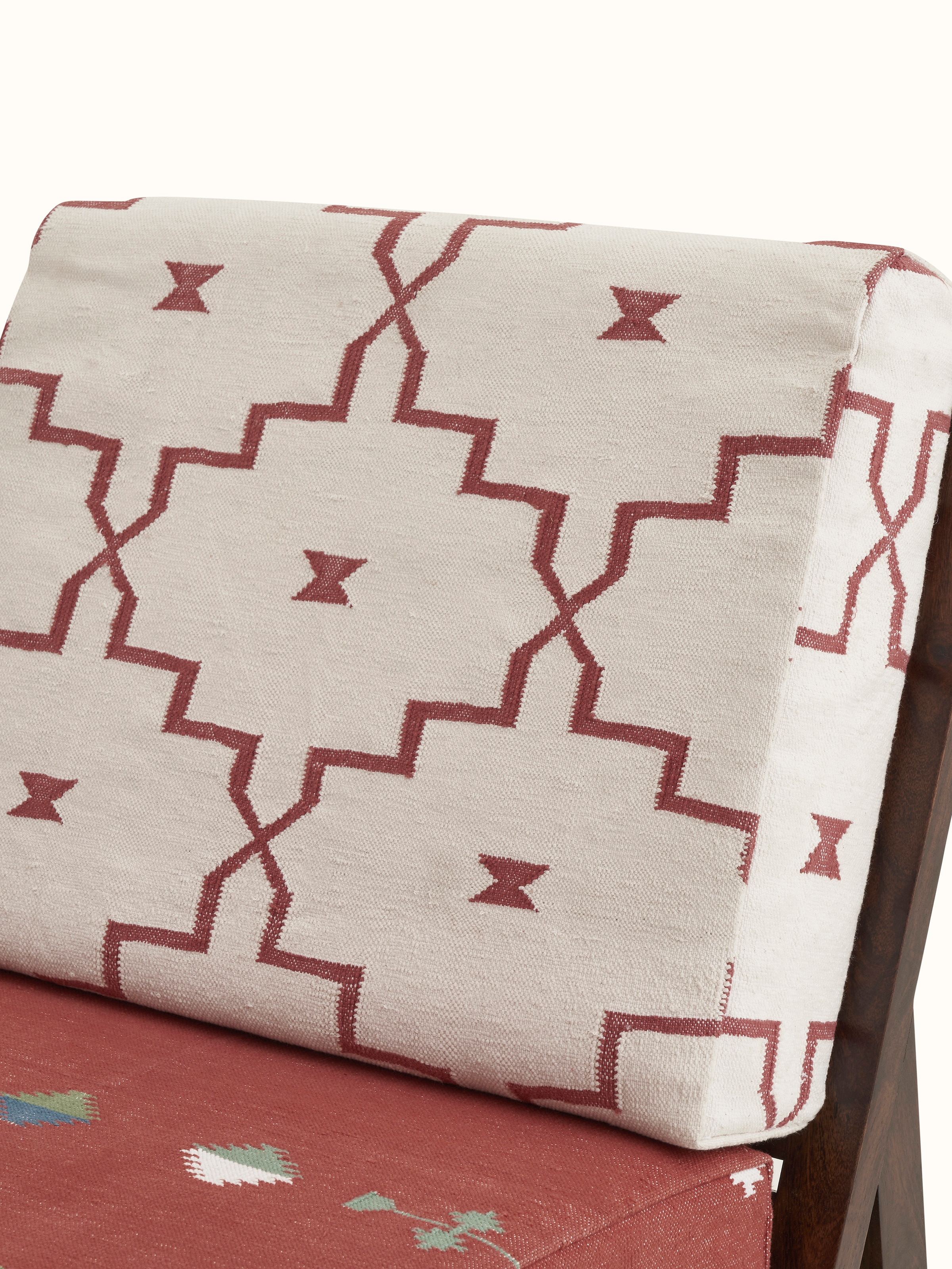 Close-up of Panja Dhurrie Upholstered Sheesham Wood Lounge Chair, focusing on the luxurious upholstery and sturdy Sheesham wood frame.