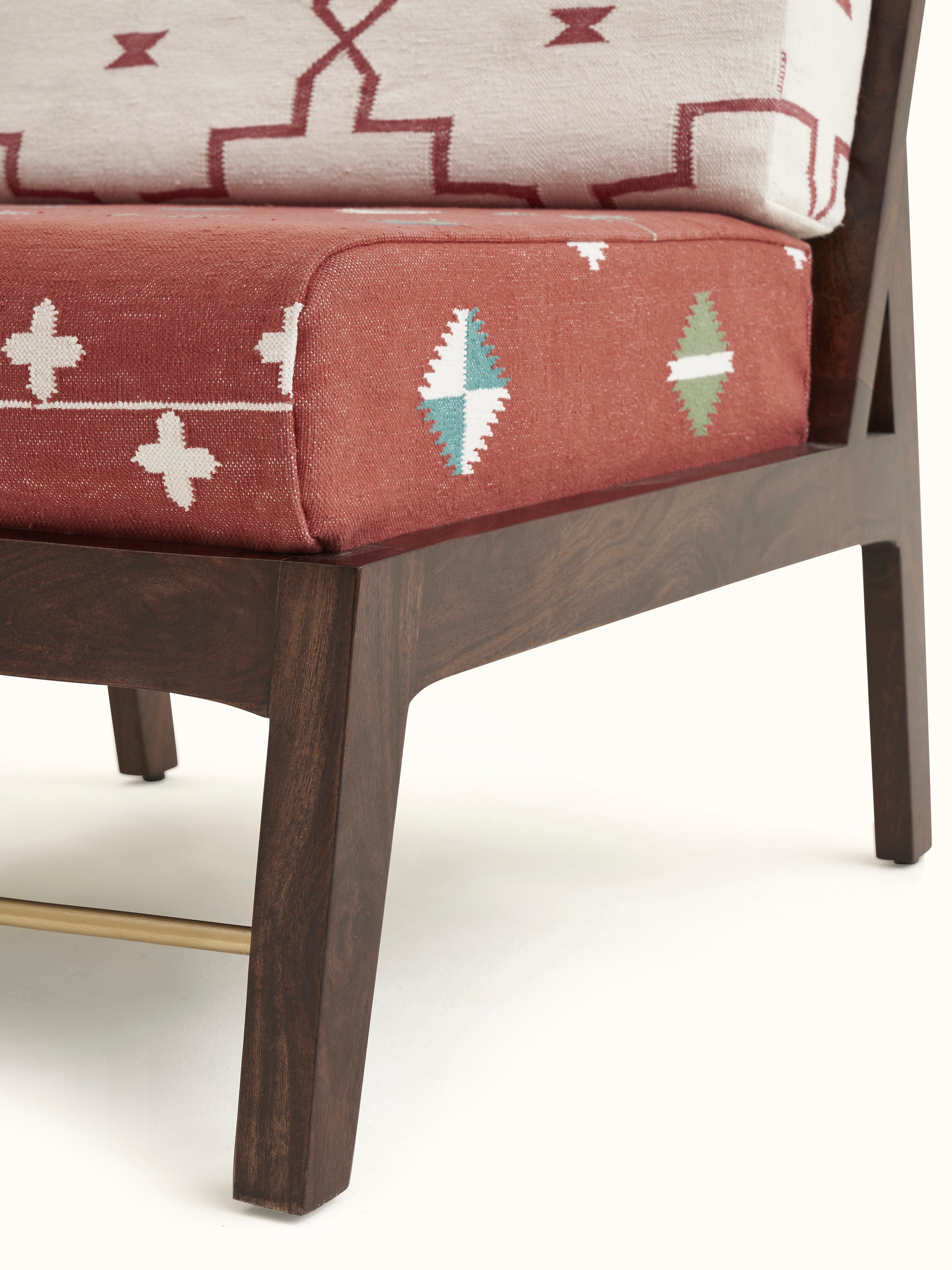 Detailed view of Panja Dhurrie Upholstered Sheesham Wood Lounge Chair, showcasing the fine craftsmanship and comfort it offers.