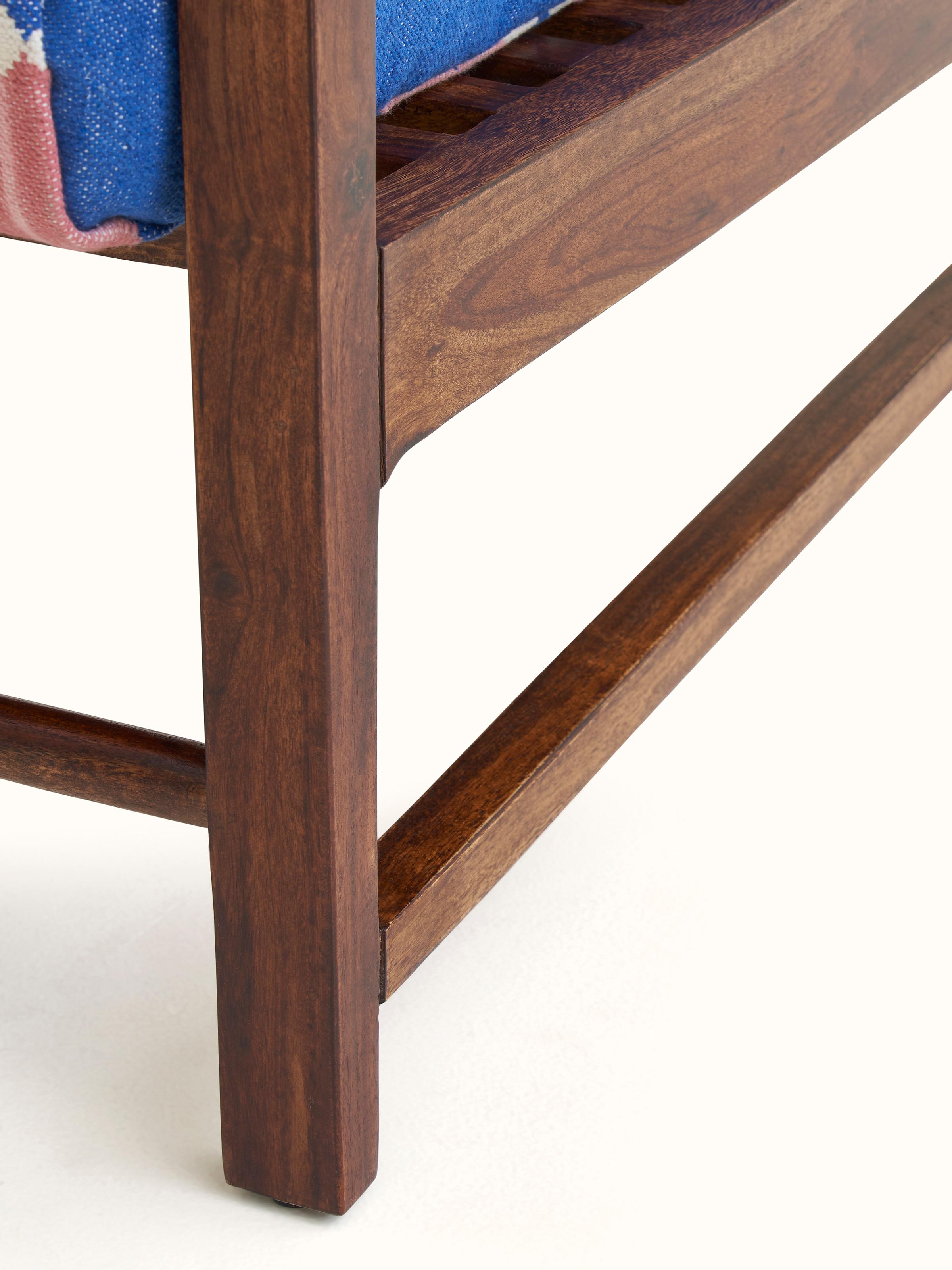 Side view of Panja Dhurrie Upholstered Sheesham Wood Lounge Chair with Arm emphasizing the wooden frame