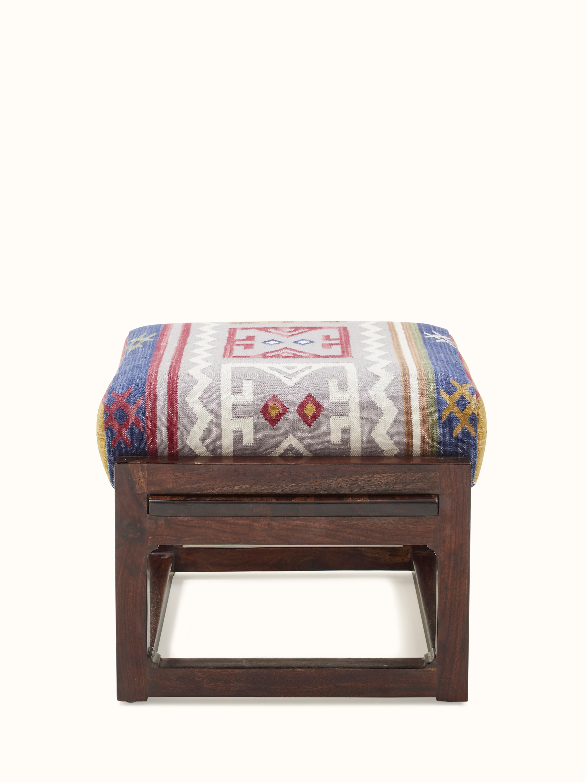 Detailed view of the ottoman’s Sheesham wood frame and Panja Dhurrie upholstery, showcasing the craftsmanship and design elements