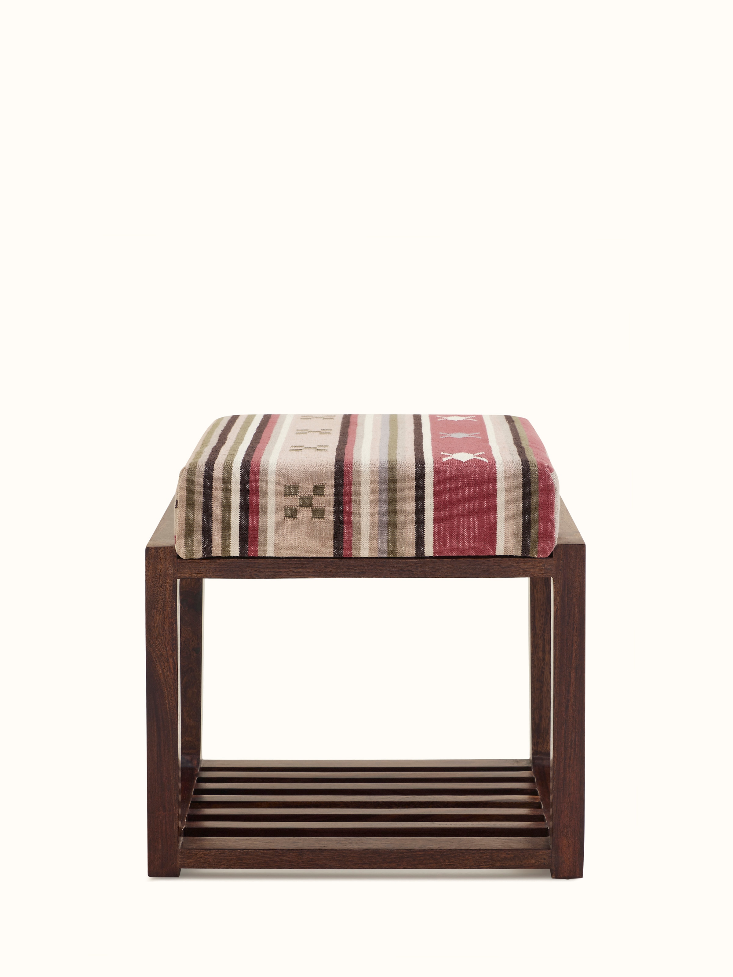 Front view of the Panja Dhurrie upholstered Sheesham wood stool with slated base, showcasing the traditional dhurrie upholstery and wood finish.
