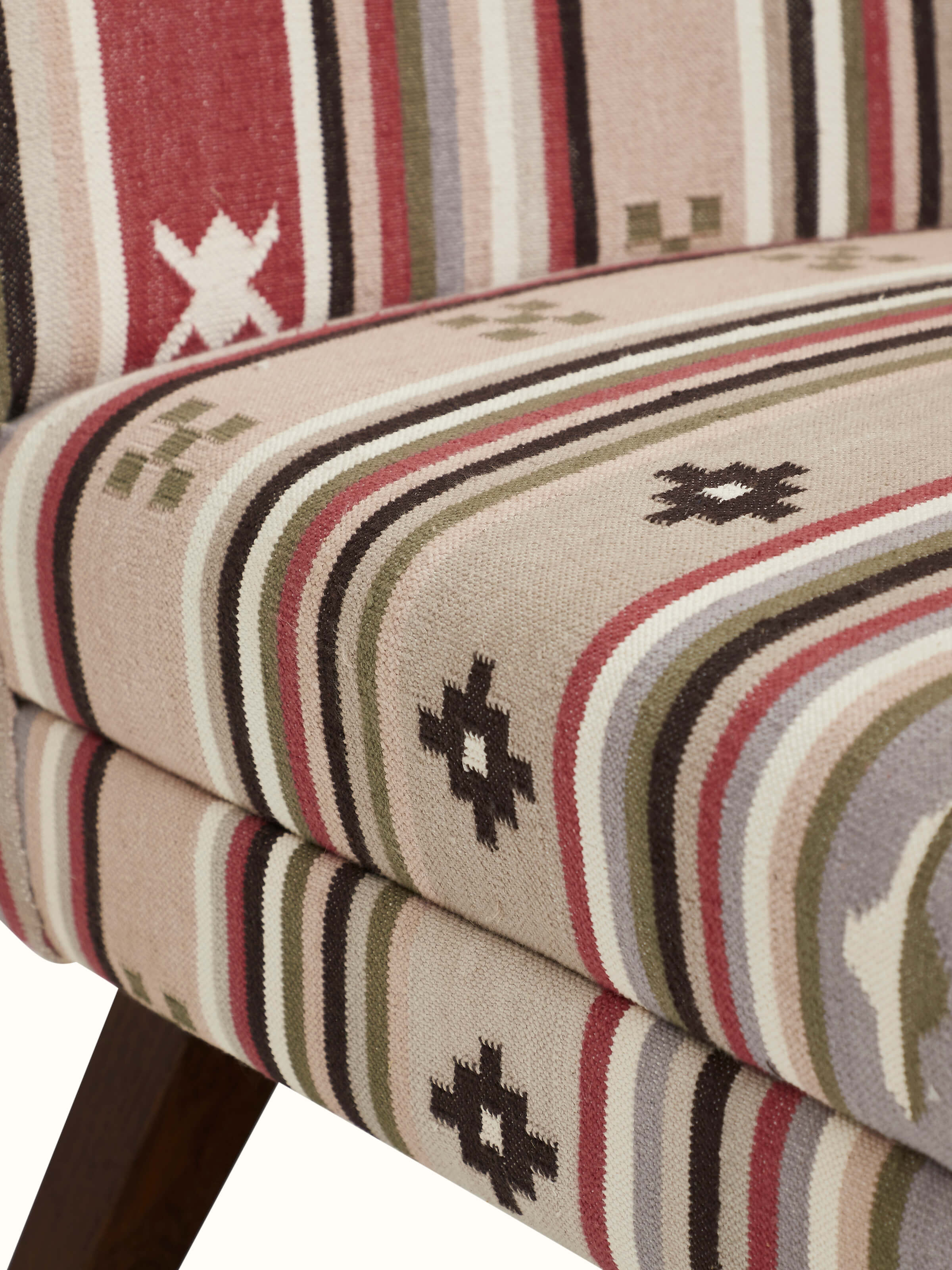 Back view of Panja Dhurrie upholstered Sheesham wood wing chair, displaying the full design and woodwork