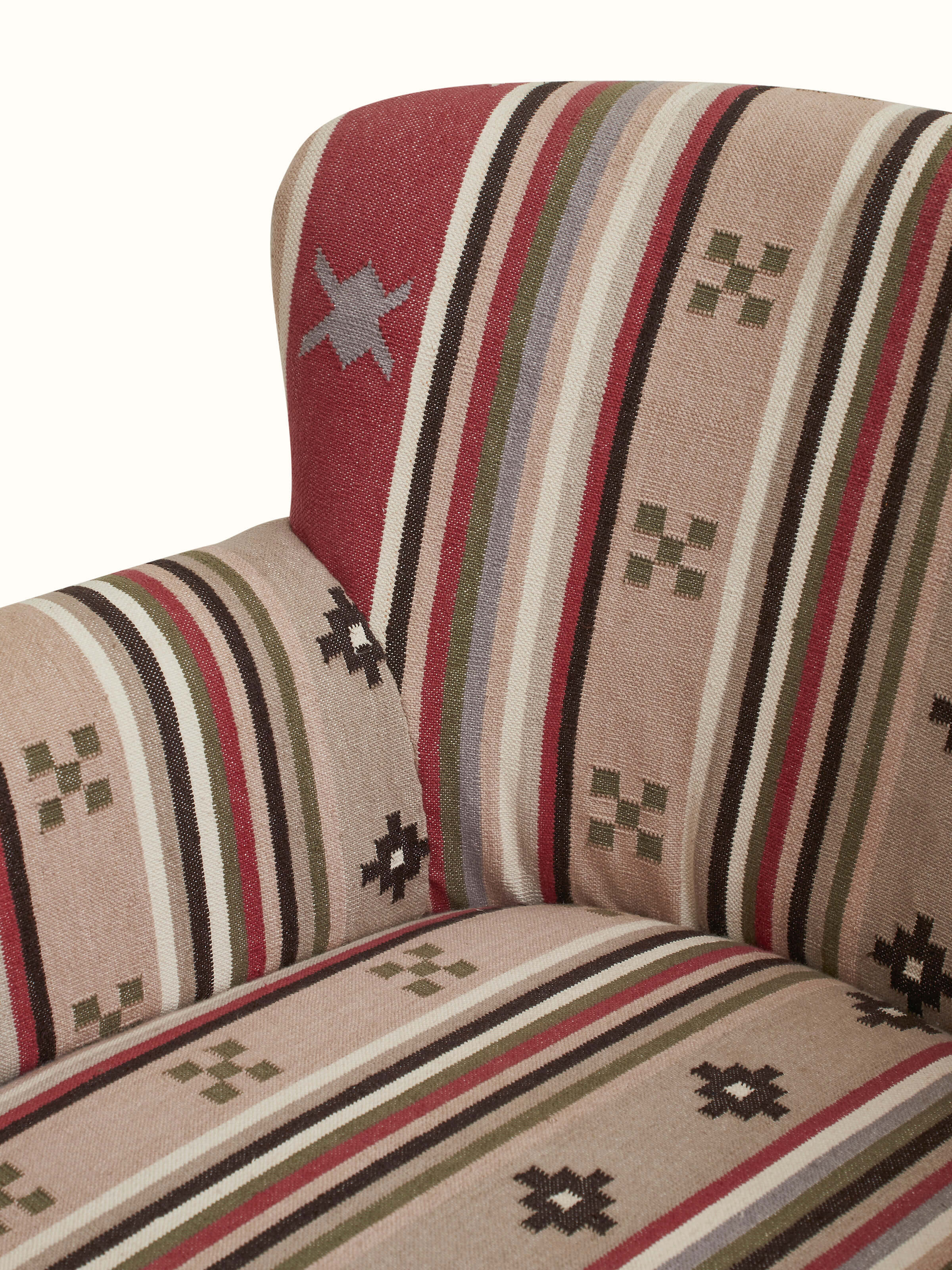 View of the Panja Dhurrie upholstered Sheesham wood wing chair from above, highlighting the intricate design