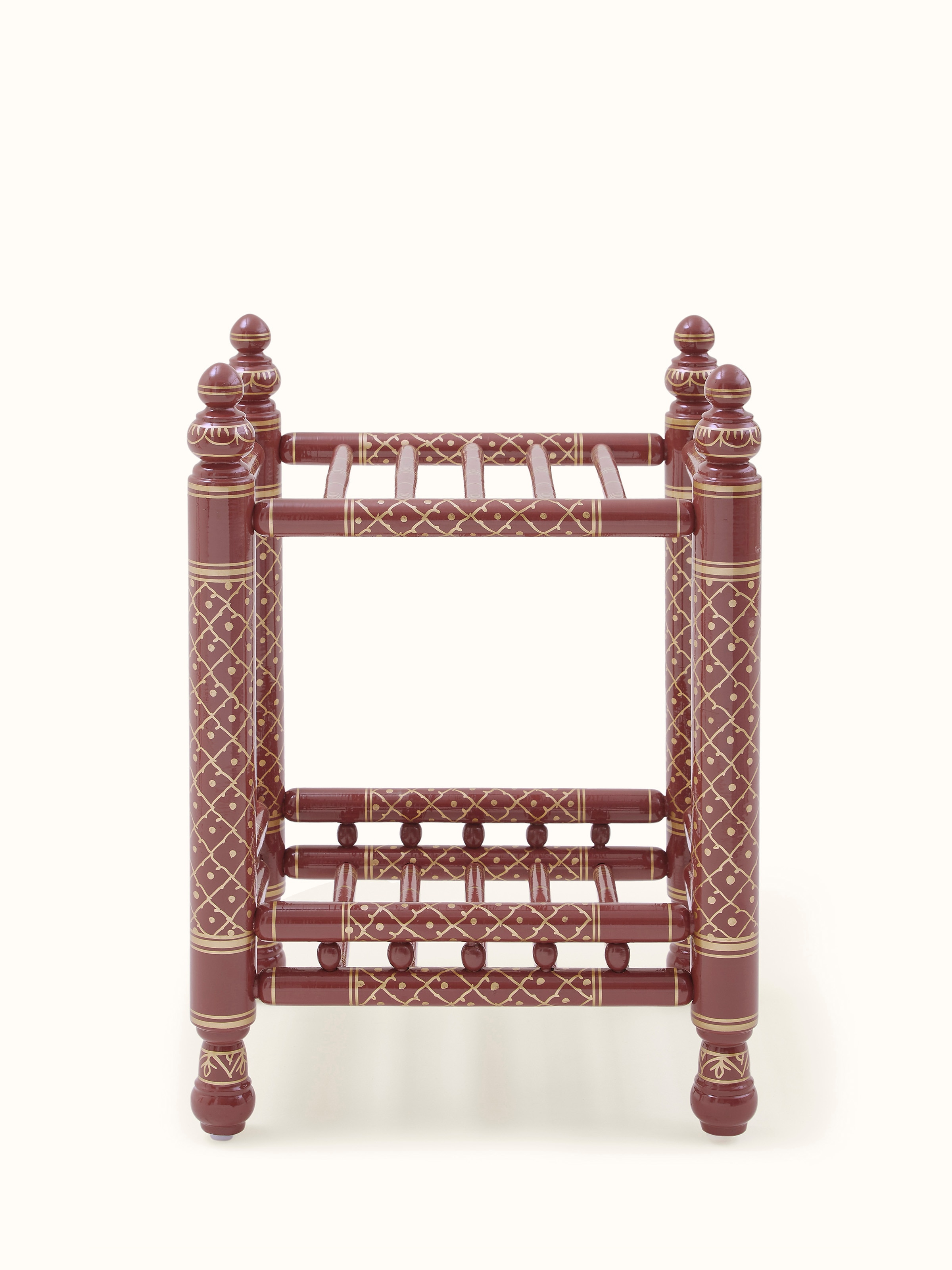 Front view of the teak wood Sankheda magazine rack, showcasing the traditional craftsmanship and wood finish