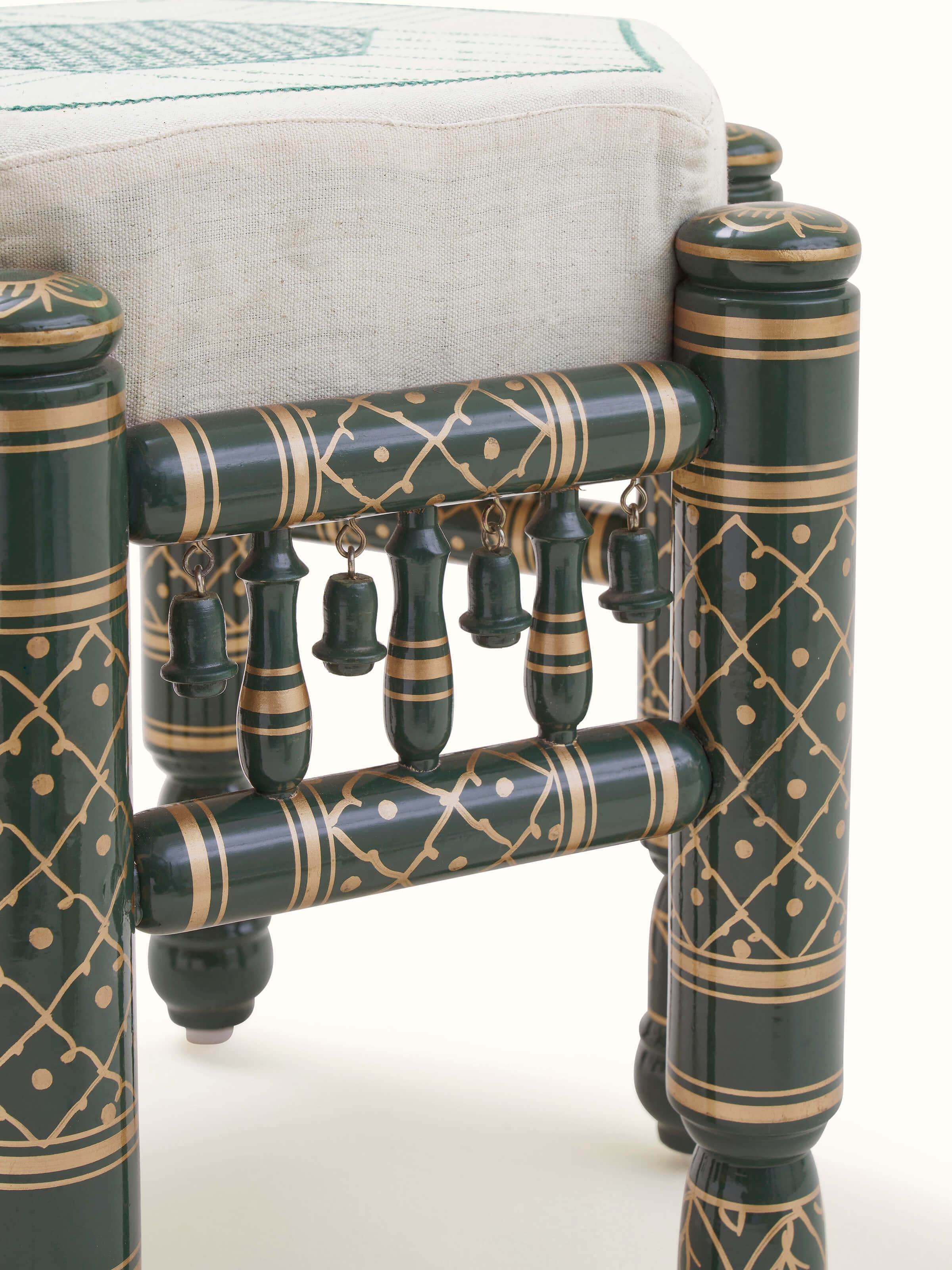 Back view of Upholstered teak wood Sankheda octagonal pouffe highlighting solid construction