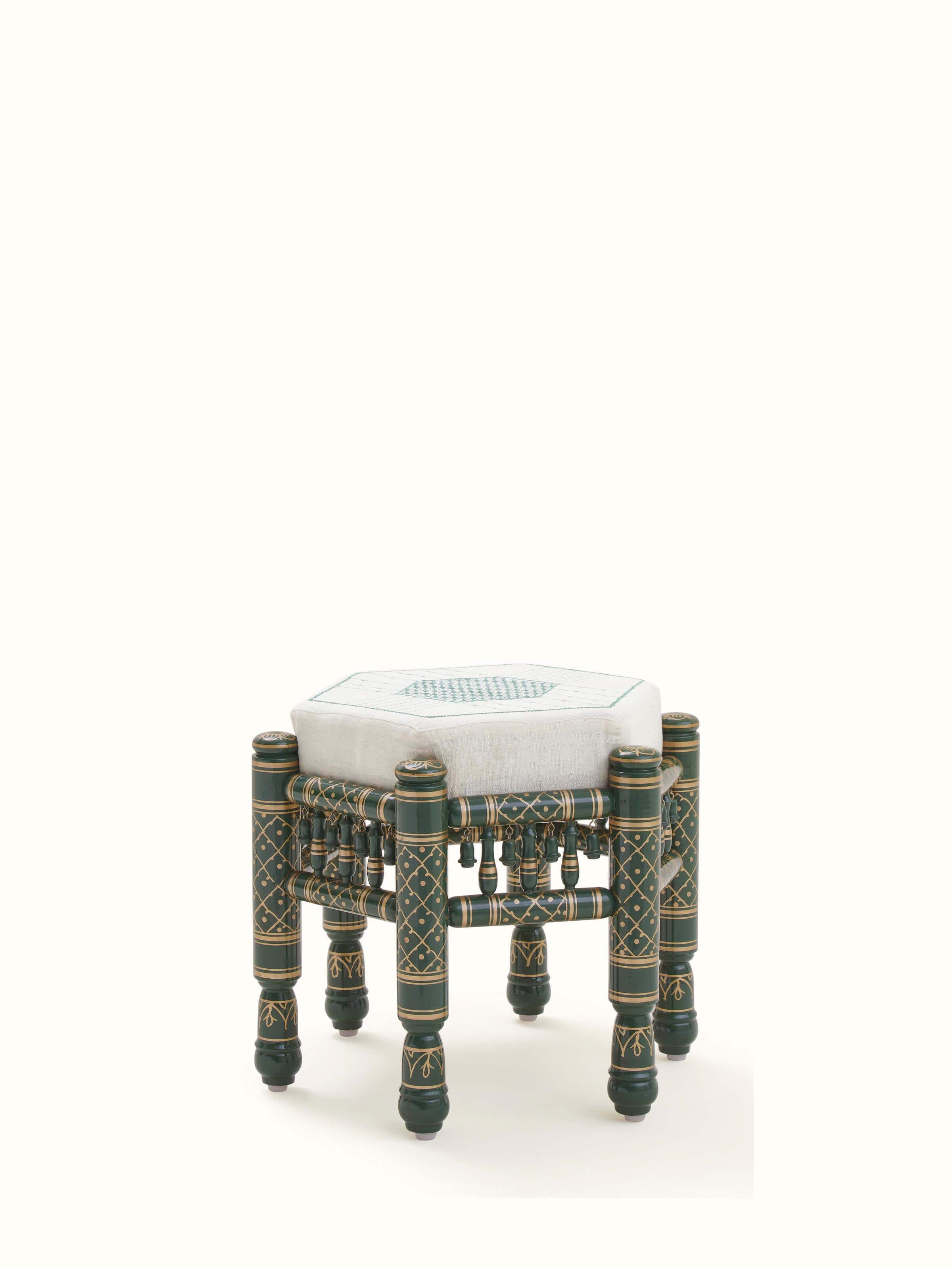 Bottom view of Upholstered teak wood Sankheda octagonal pouffe displaying intricate patterns