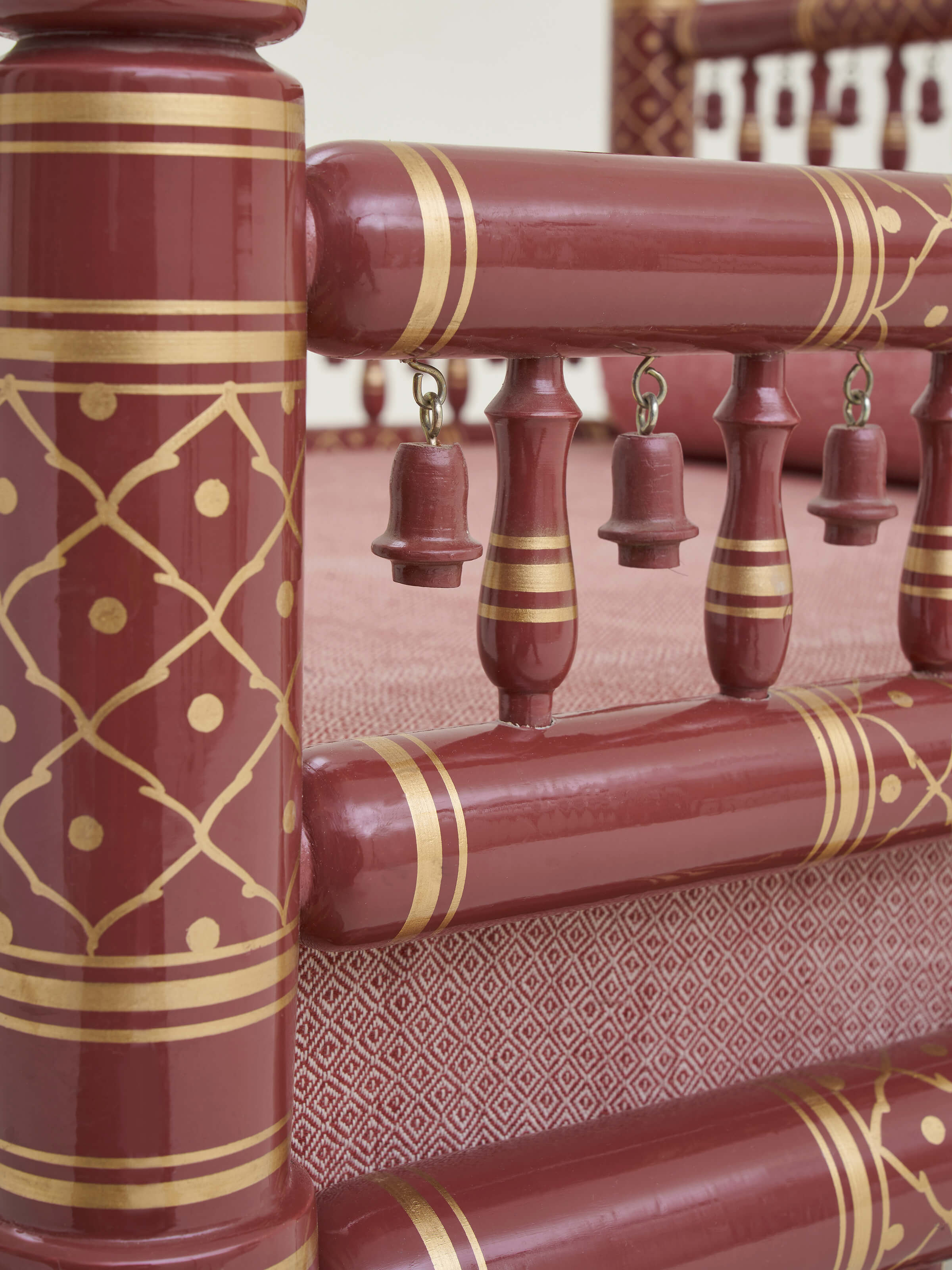 Detailed view of the teak wood legs of the Sankheda 1-seater sofa, showcasing the quality craftsmanship and wood finish.