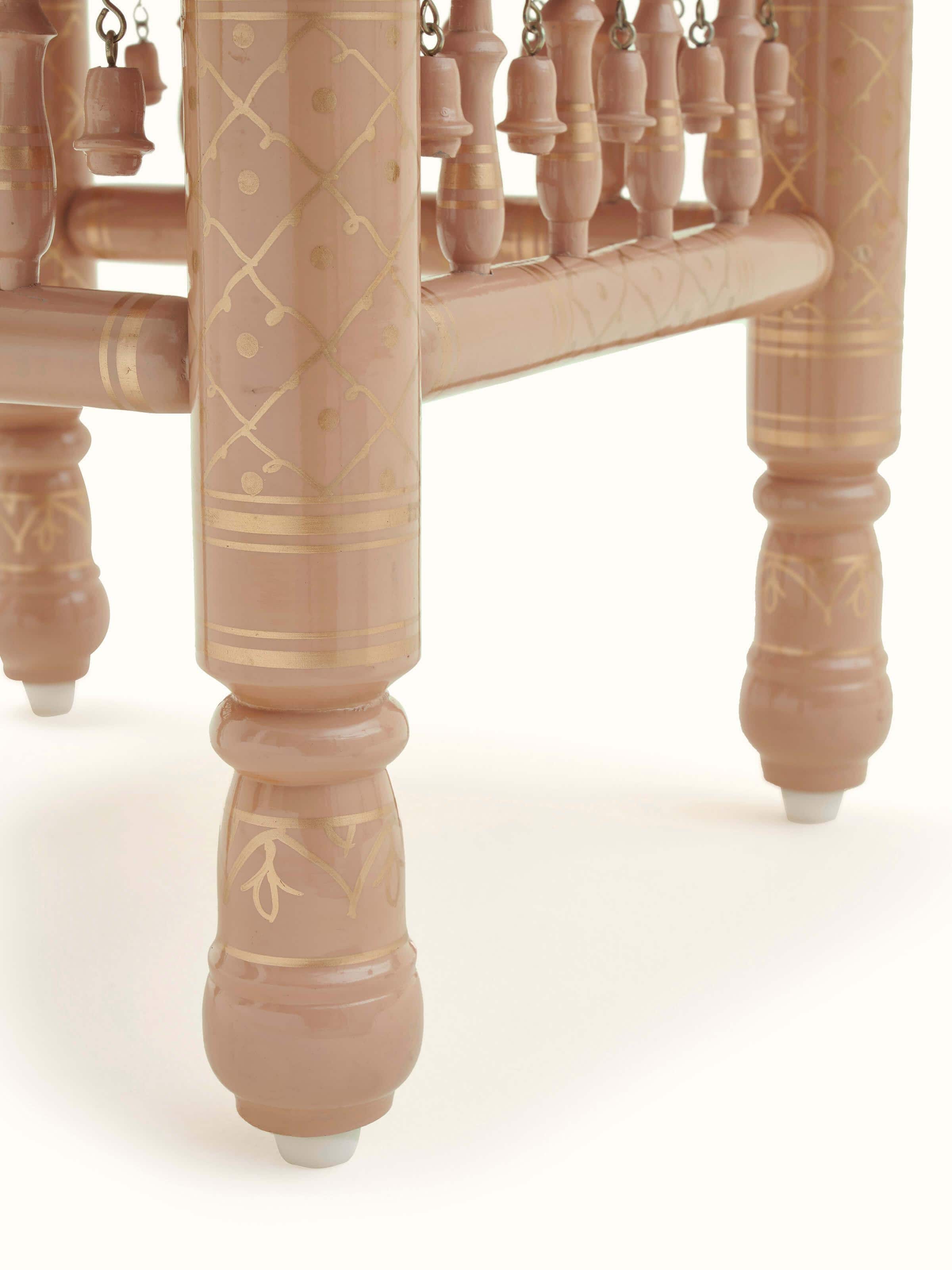 Close-up of the carving detail on the legs of the Teak wood Sankheda stool