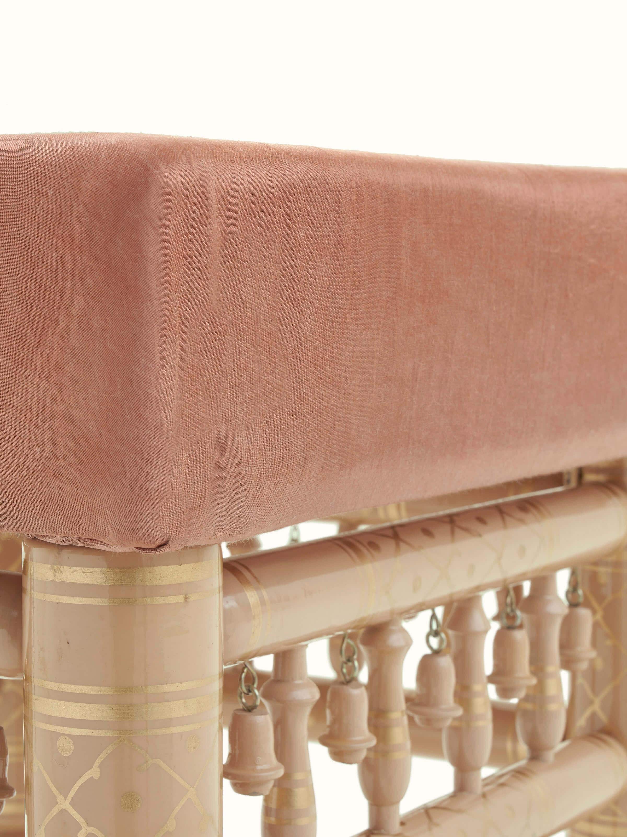 Side profile of the Teak wood Sankheda stool, highlighting the wood and upholstery combination