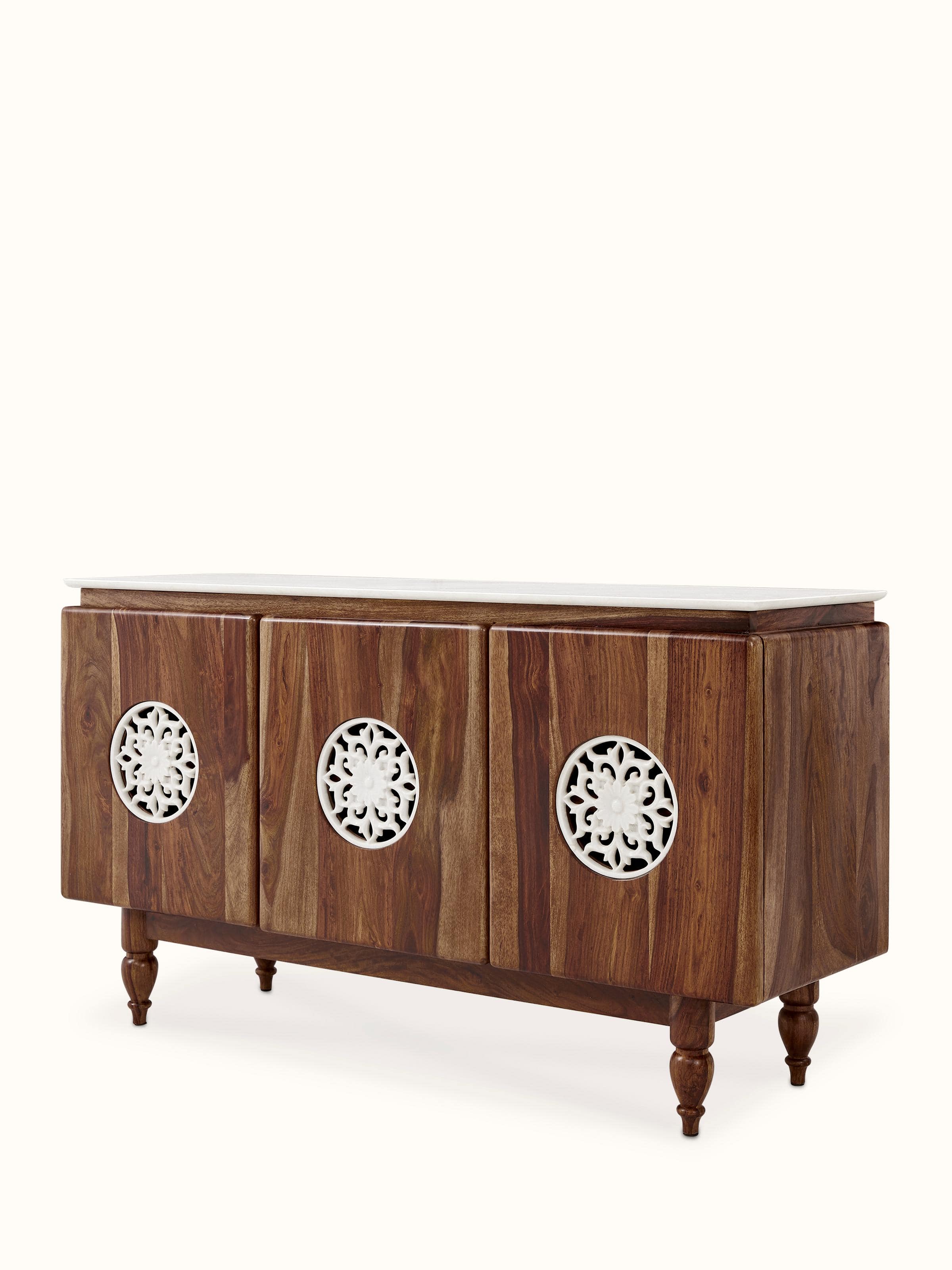 Angled view of walnut finish carved marble & sheesham wood sideboard showing decorative features