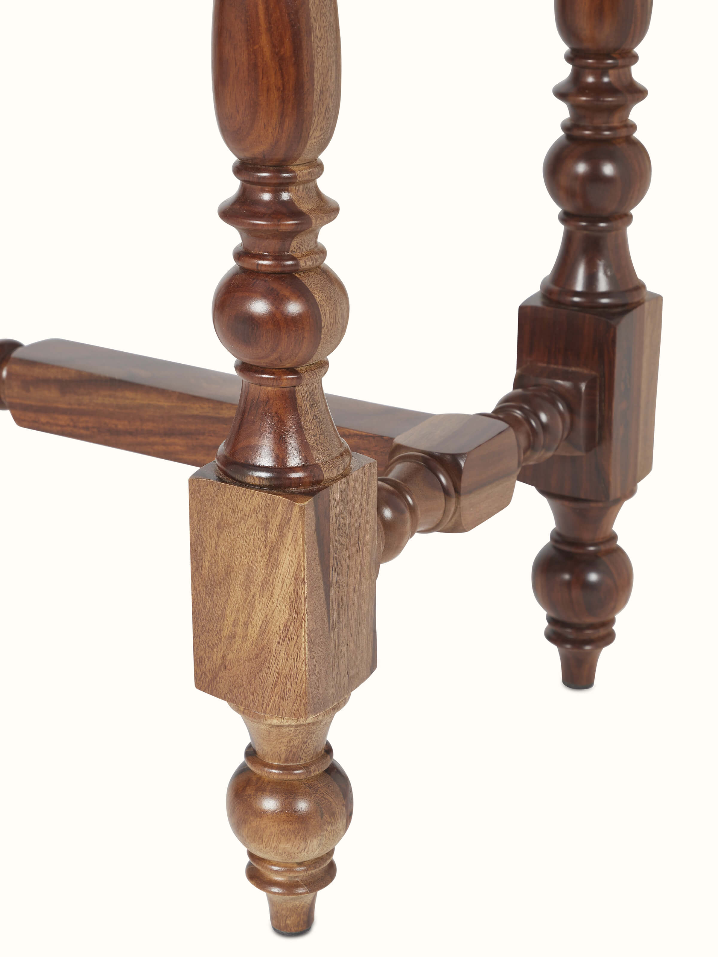 Angled view of the walnut finish carved marble and Sheesham wood console table, highlighting the overall structure and design details