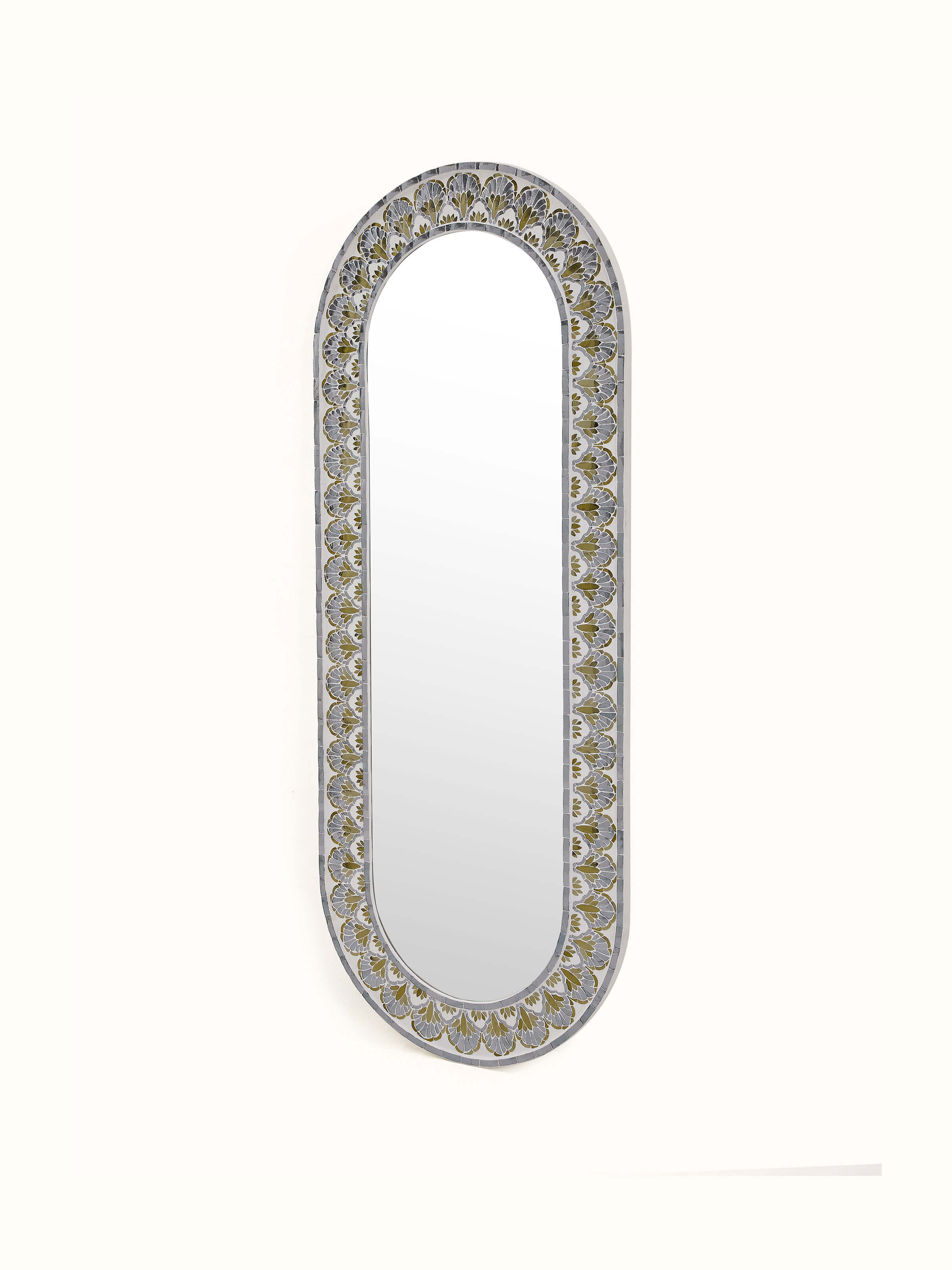 Angled view of glass floral inlay oval full-length mirror, highlighting detailed craftsmanship and floral inlay work.