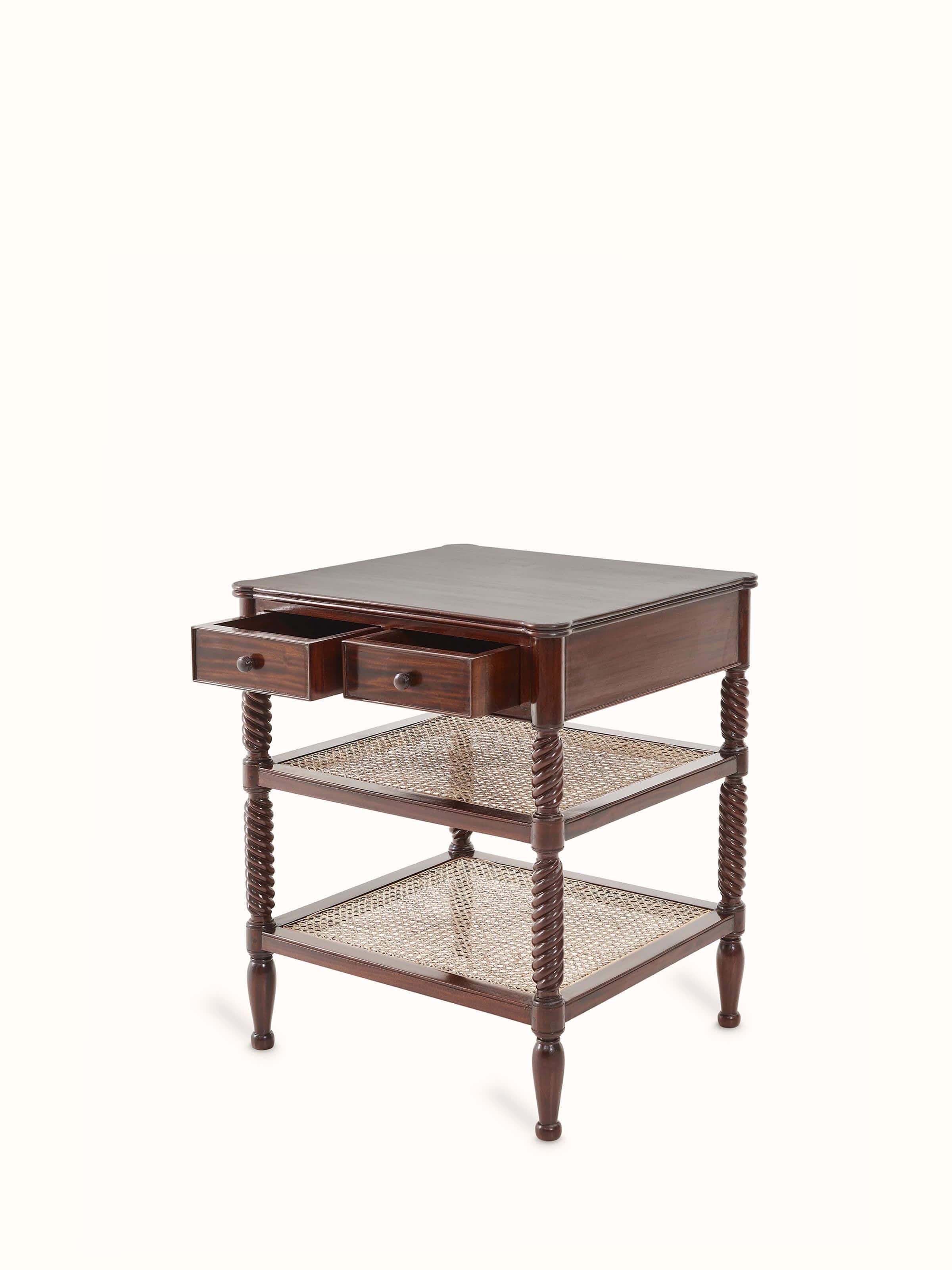 Close-up of the cane detailing on the mahogany wood and cane bedside table, highlighting the artisanal craftsmanship.