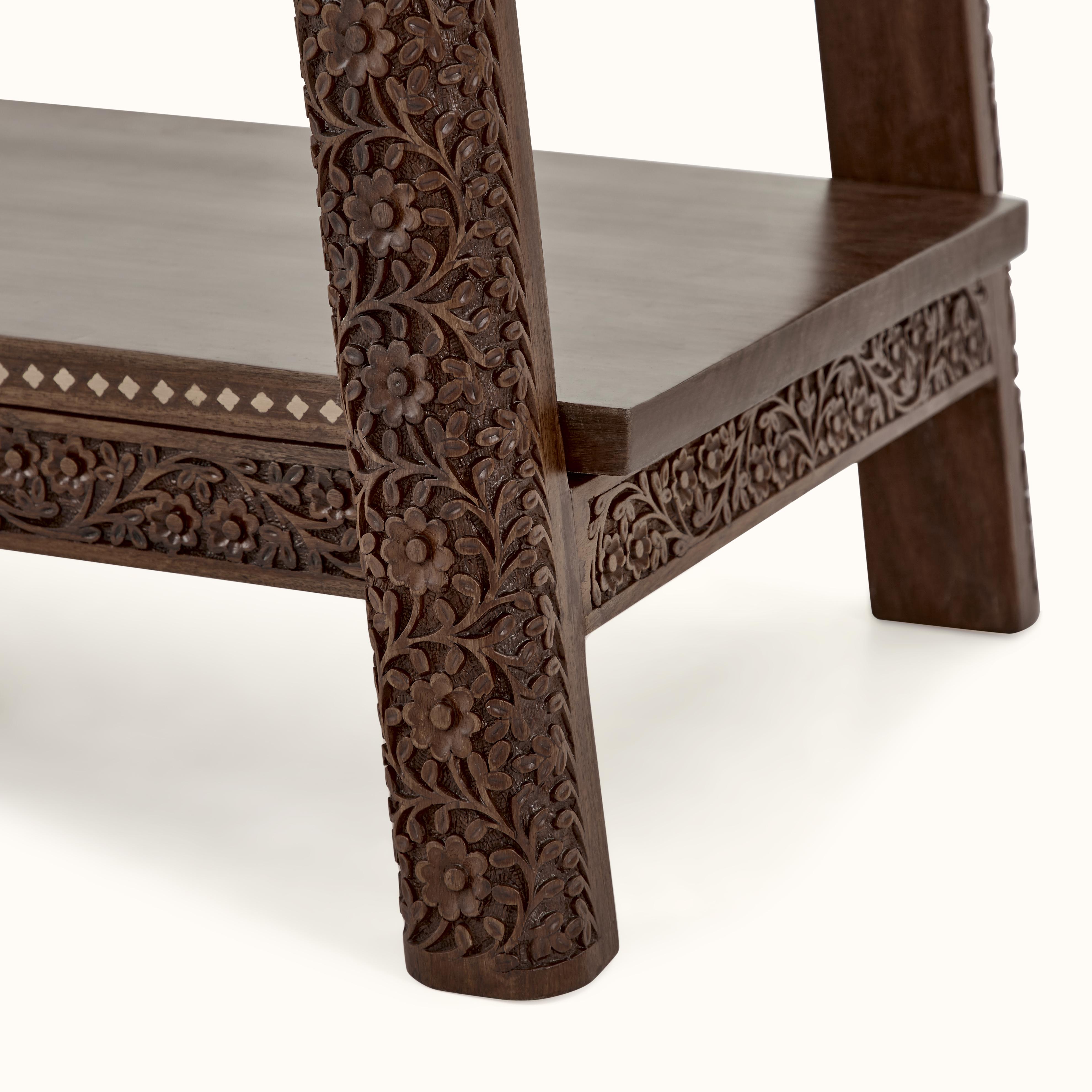 Top view of carved sheesham wood bookshelf, highlighting smooth finish and detailed carvings