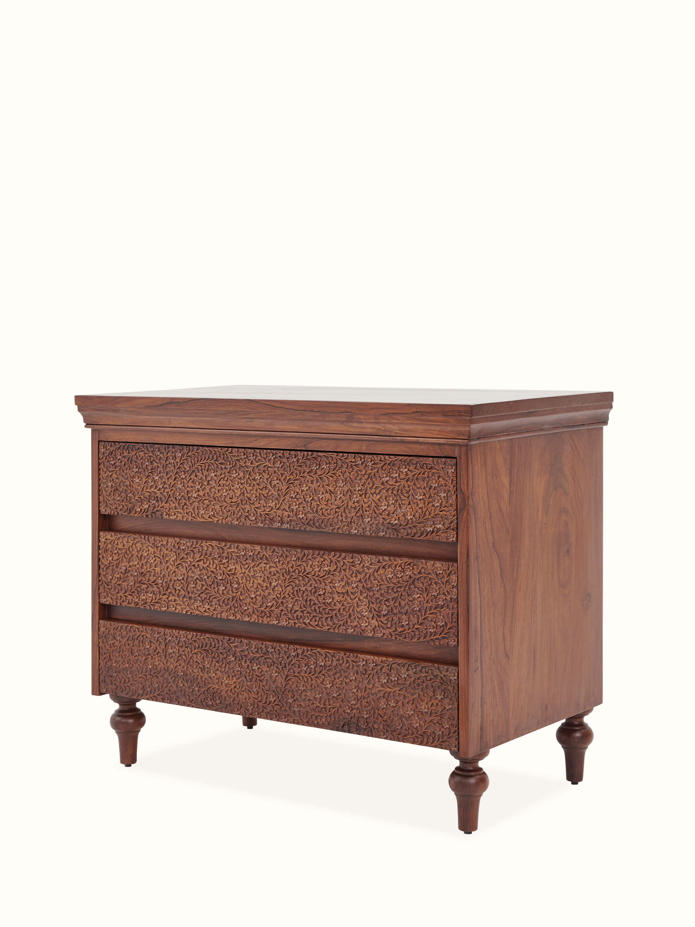 Angle view of Carved Sheesham Chest of Drawers highlighting artistic carving details and quality finish.