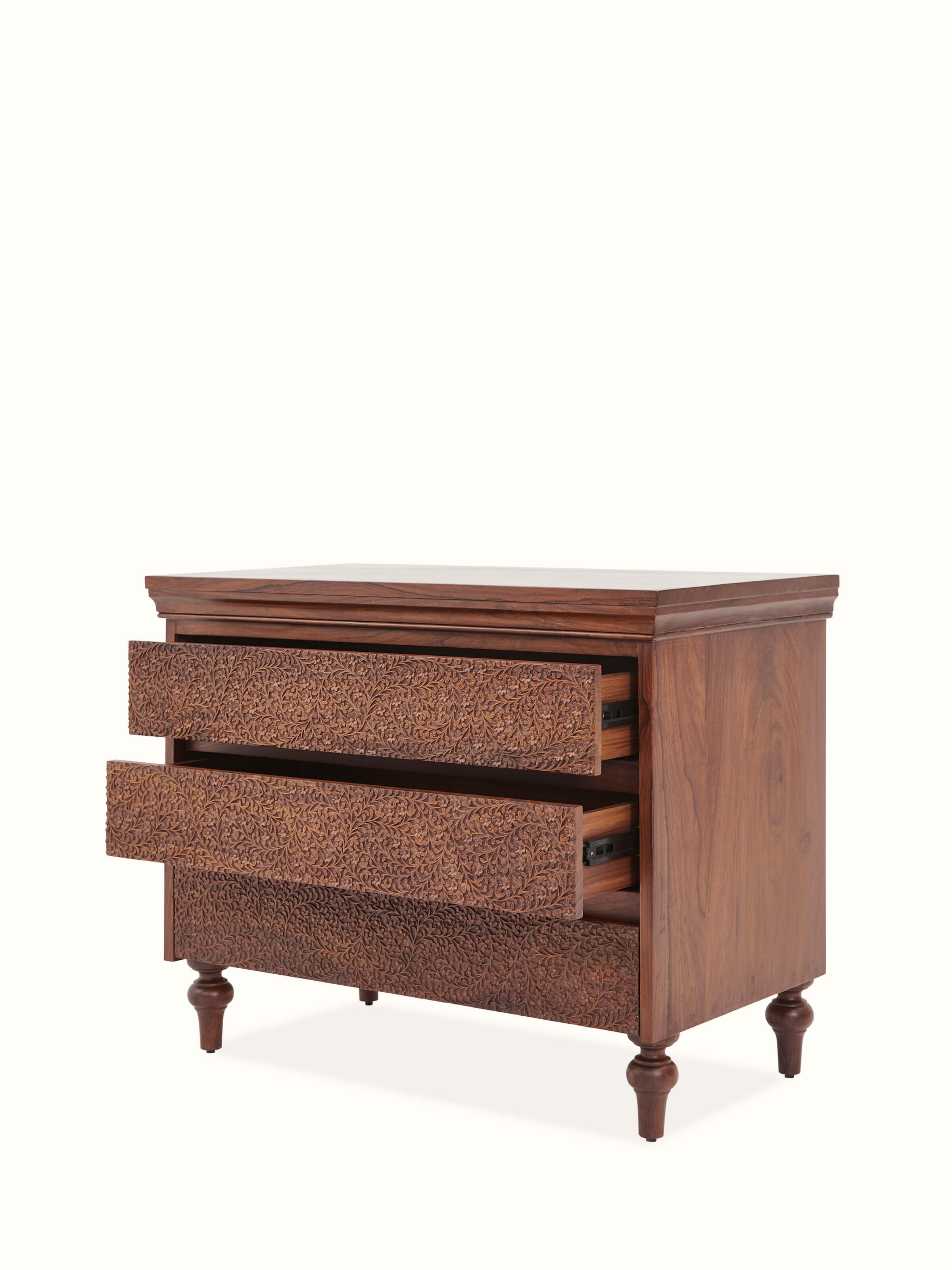 View of Carved Sheesham Chest of Drawers with open drawers showcasing spacious storage and intricate carvings.