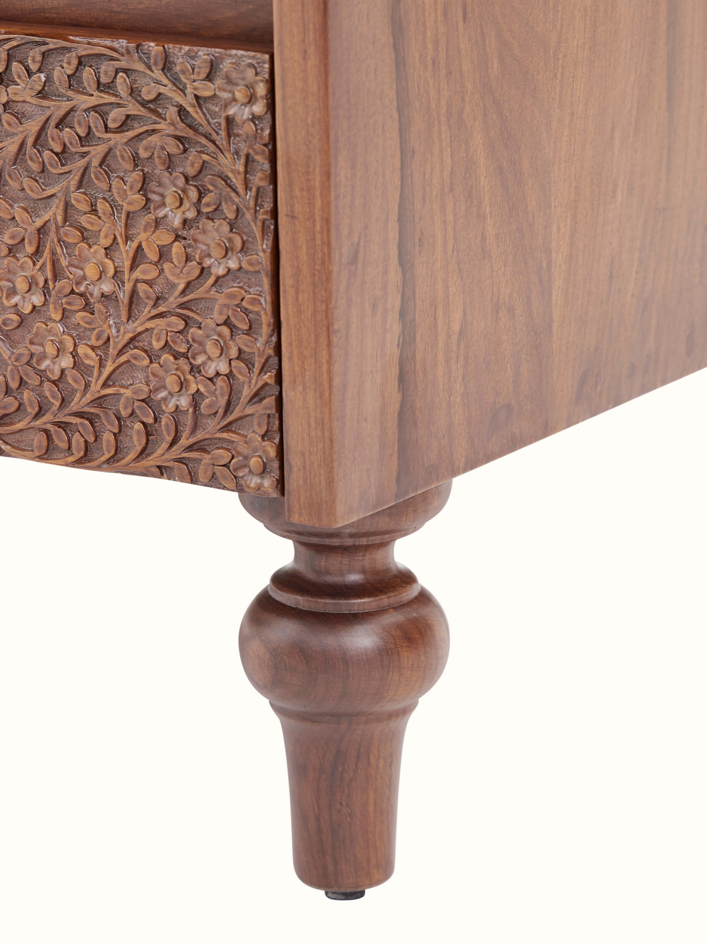 Close-up view of Carved Sheesham Chest of Drawers focusing on drawer fronts and rich wood texture.