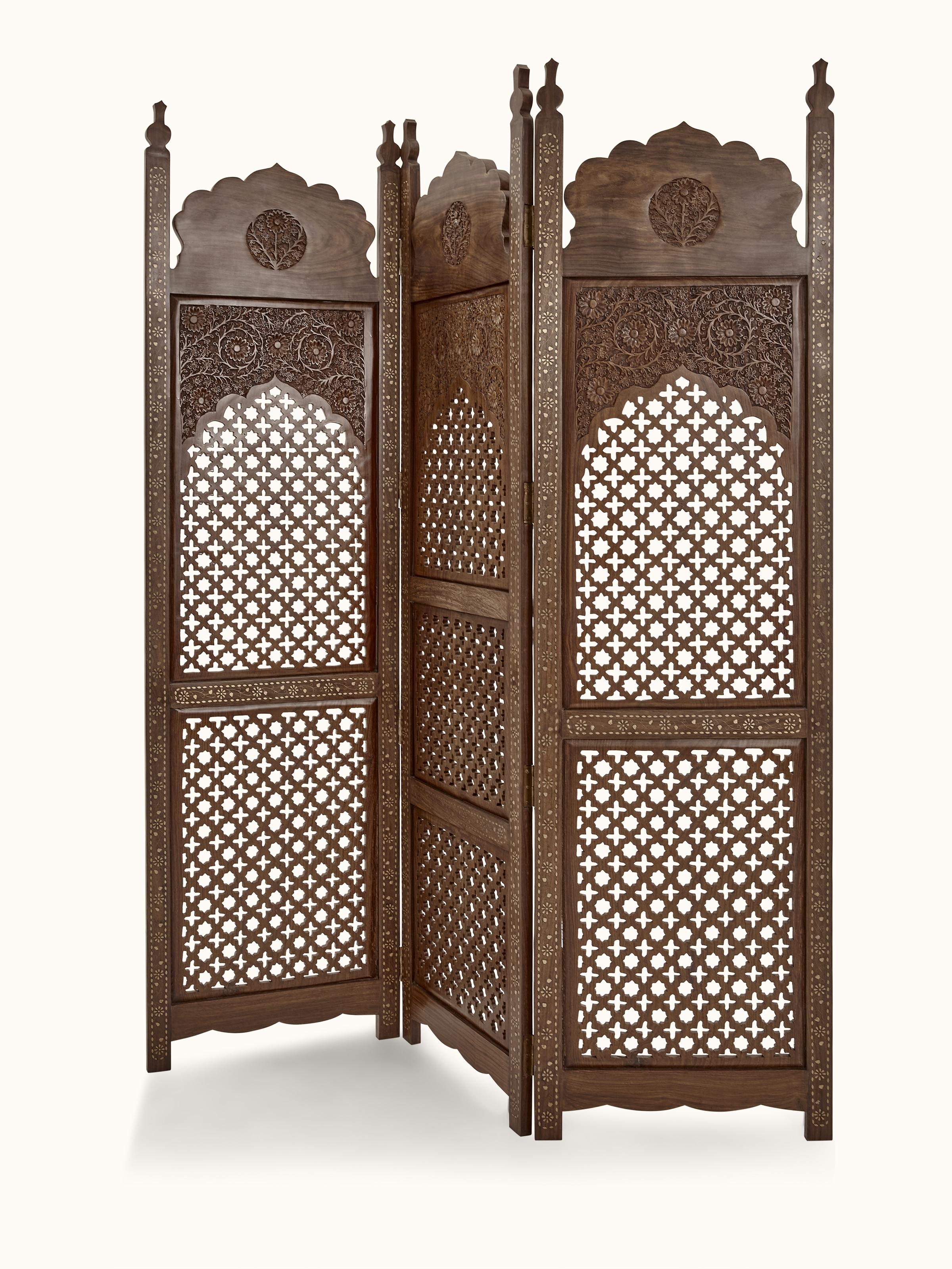 Angled view of carved Sheesham wood partition screen, emphasizing the depth and texture of the carvings.