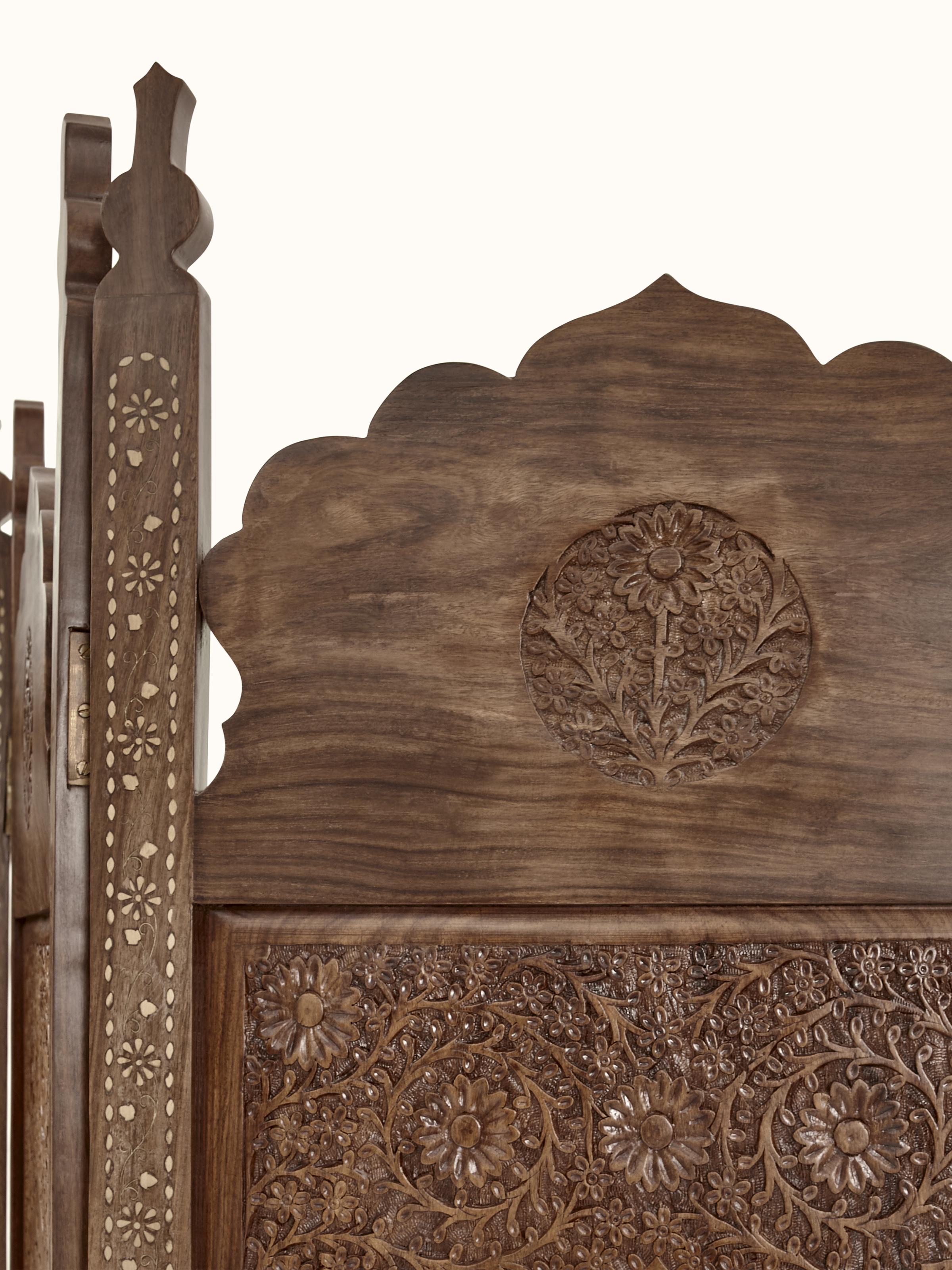 View of the carved Sheesham wood partition screen from another angle, highlighting its decorative elements.
