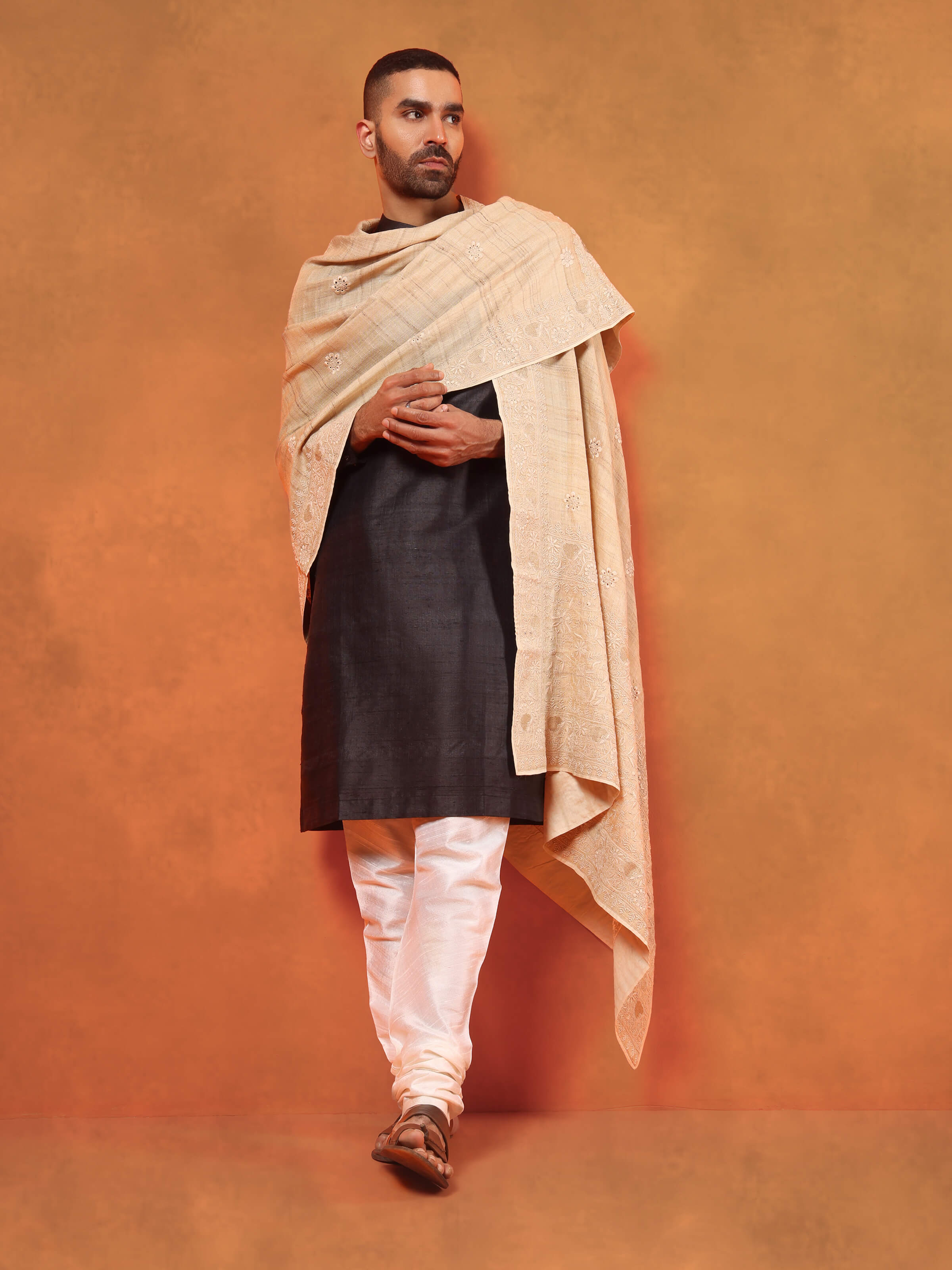 Lifestyle shot demonstrating the soft drape and natural sheen of the Tussar silk.
