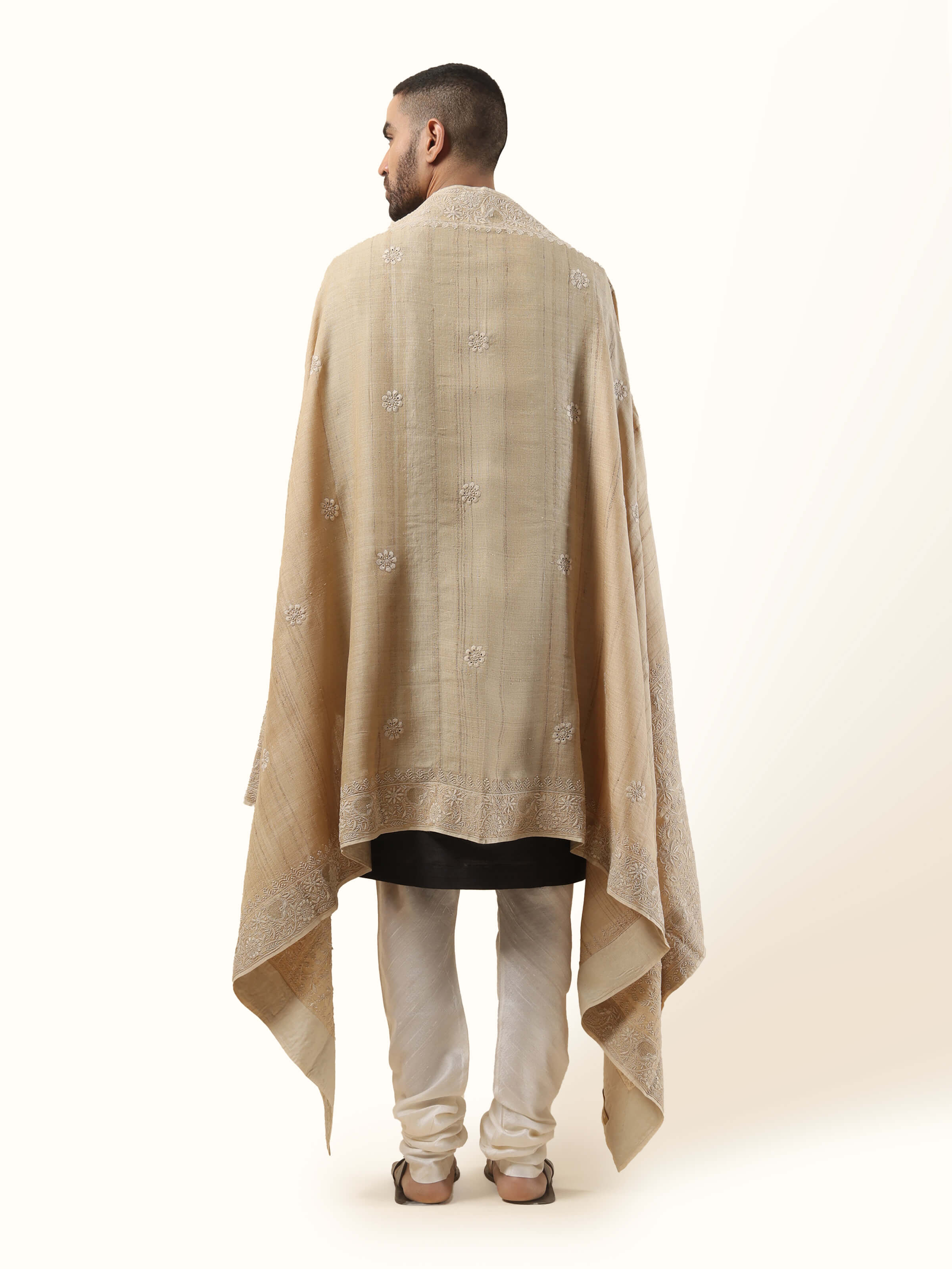 Back view displaying the delicate craftsmanship and refined charm of this heritage-inspired wrap.