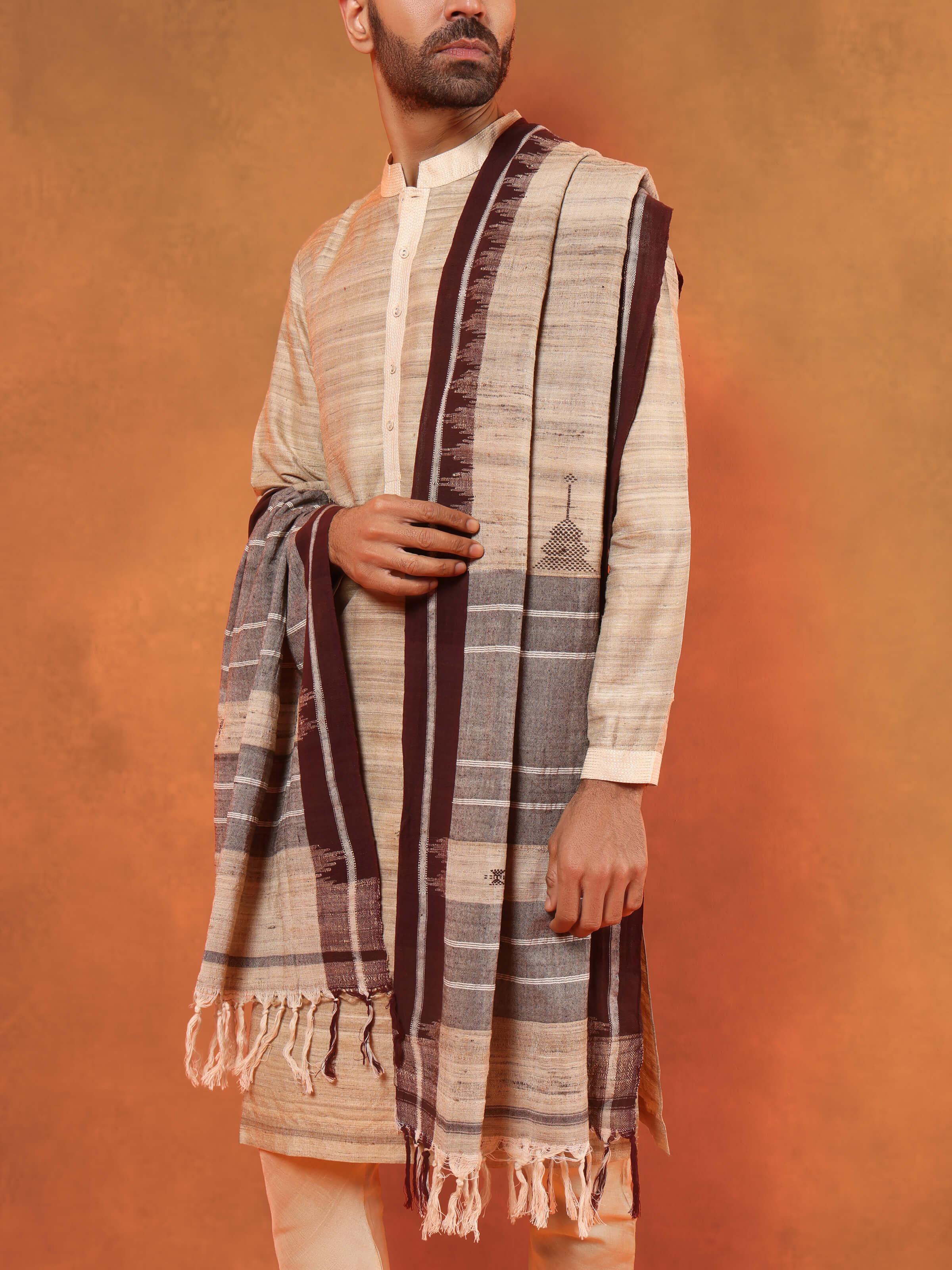 Angled shot highlighting the handcrafted motifs and natural dye.