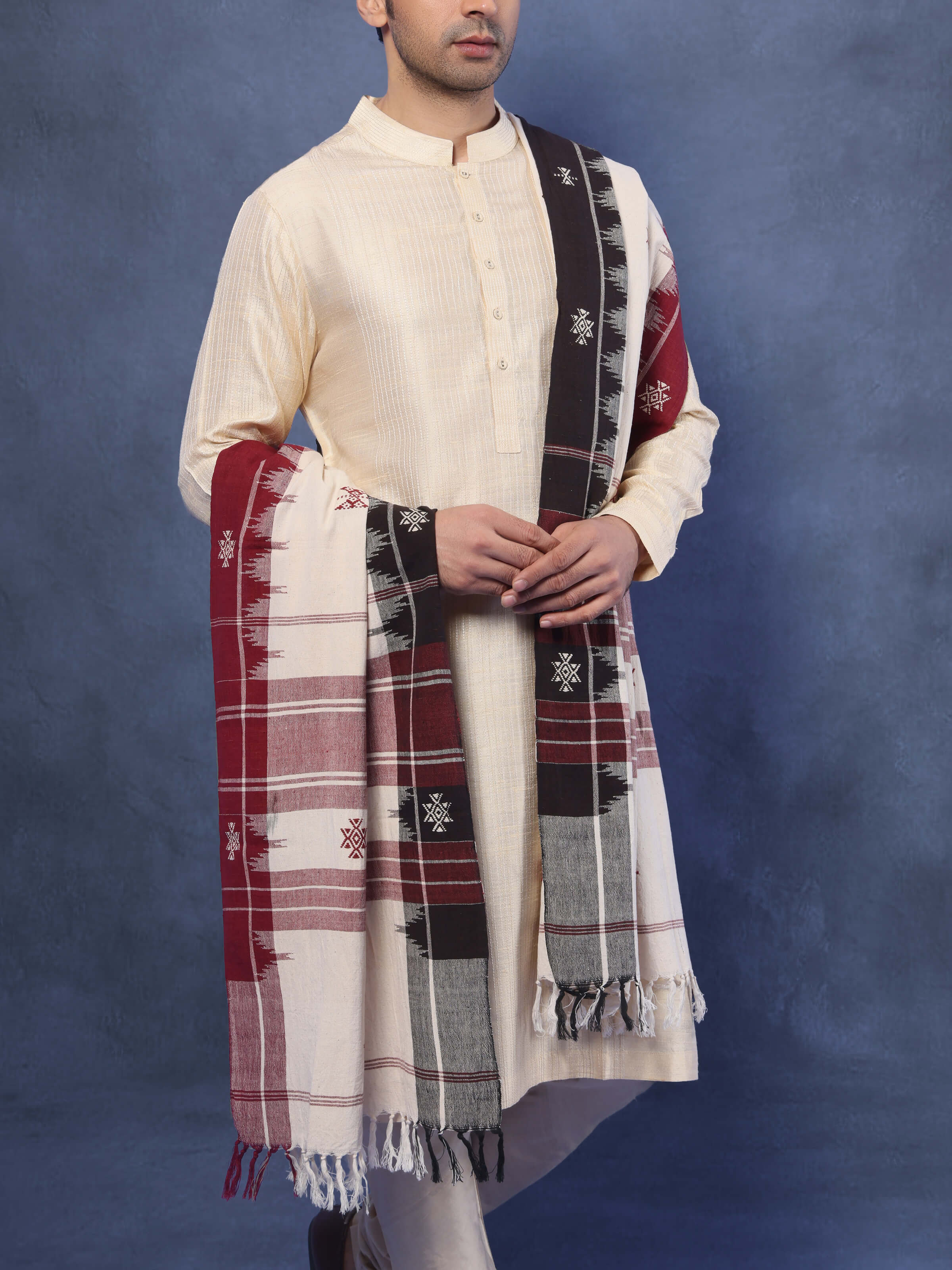 Angled view showcasing soft drape and tribal pattern of brown Kotpad stole
