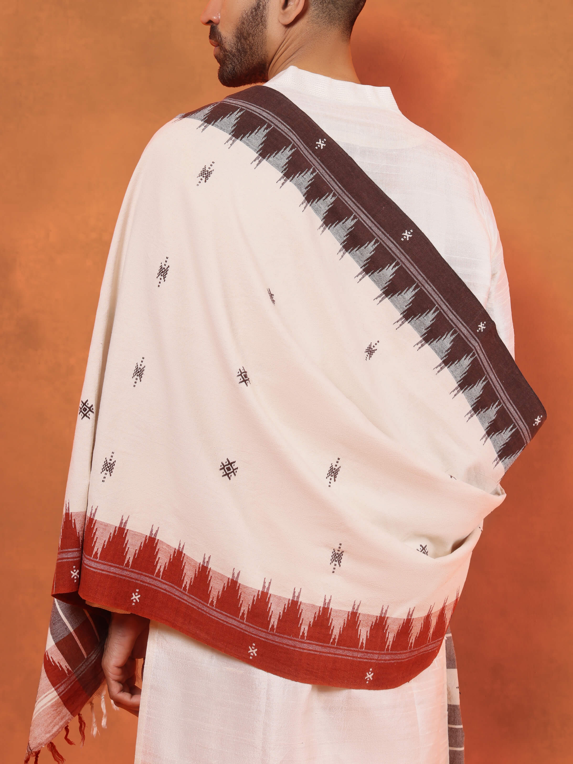 Angled view of Maroon Cotton Kotpad Stole displaying intricate Kotpad tribal motifs in maroon shade.