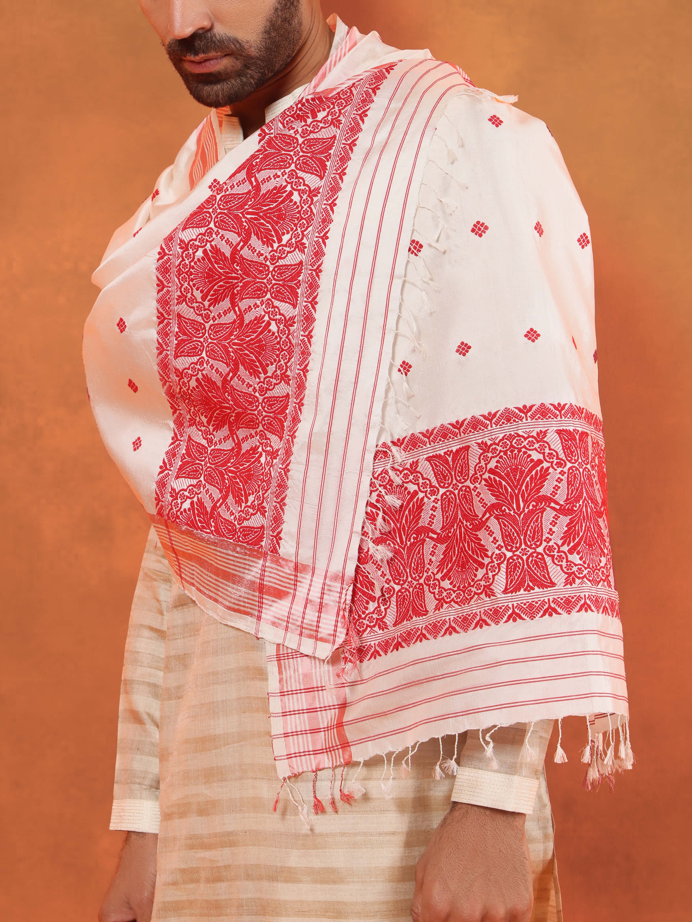 White mulberry silk stole draped elegantly on a mannequin, showcasing its lightweight and delicate fabric.