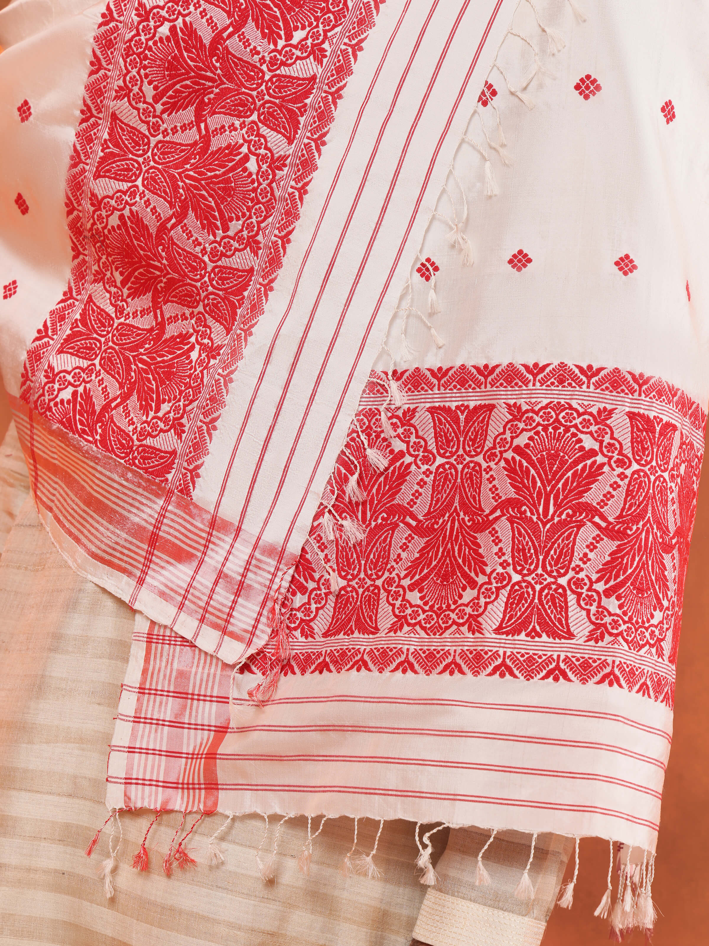 Detailed shot of white mulberry silk stole’s fabric texture and soft drape.