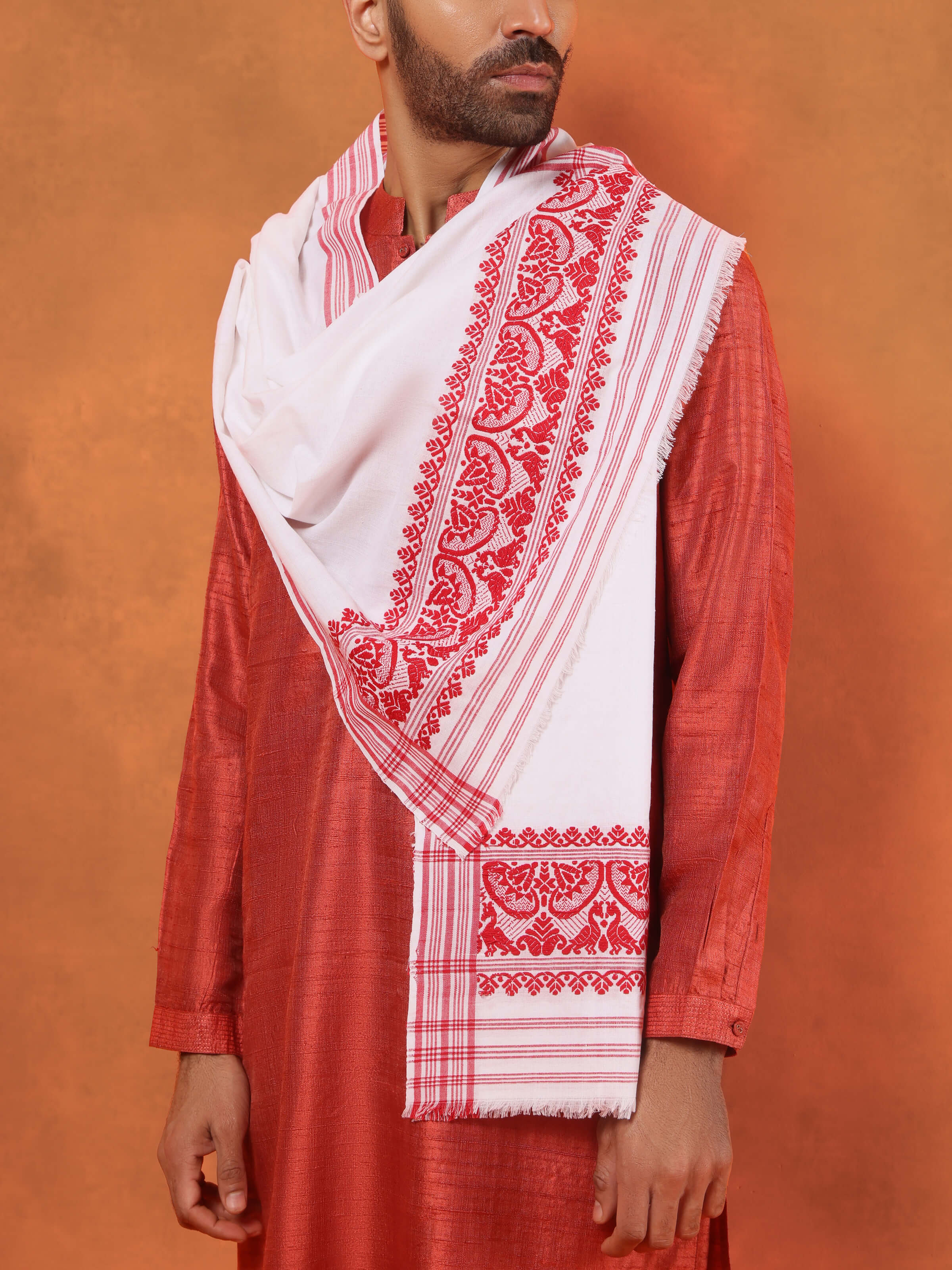 Angled view of white stole showing soft creases and minimal aesthetic.