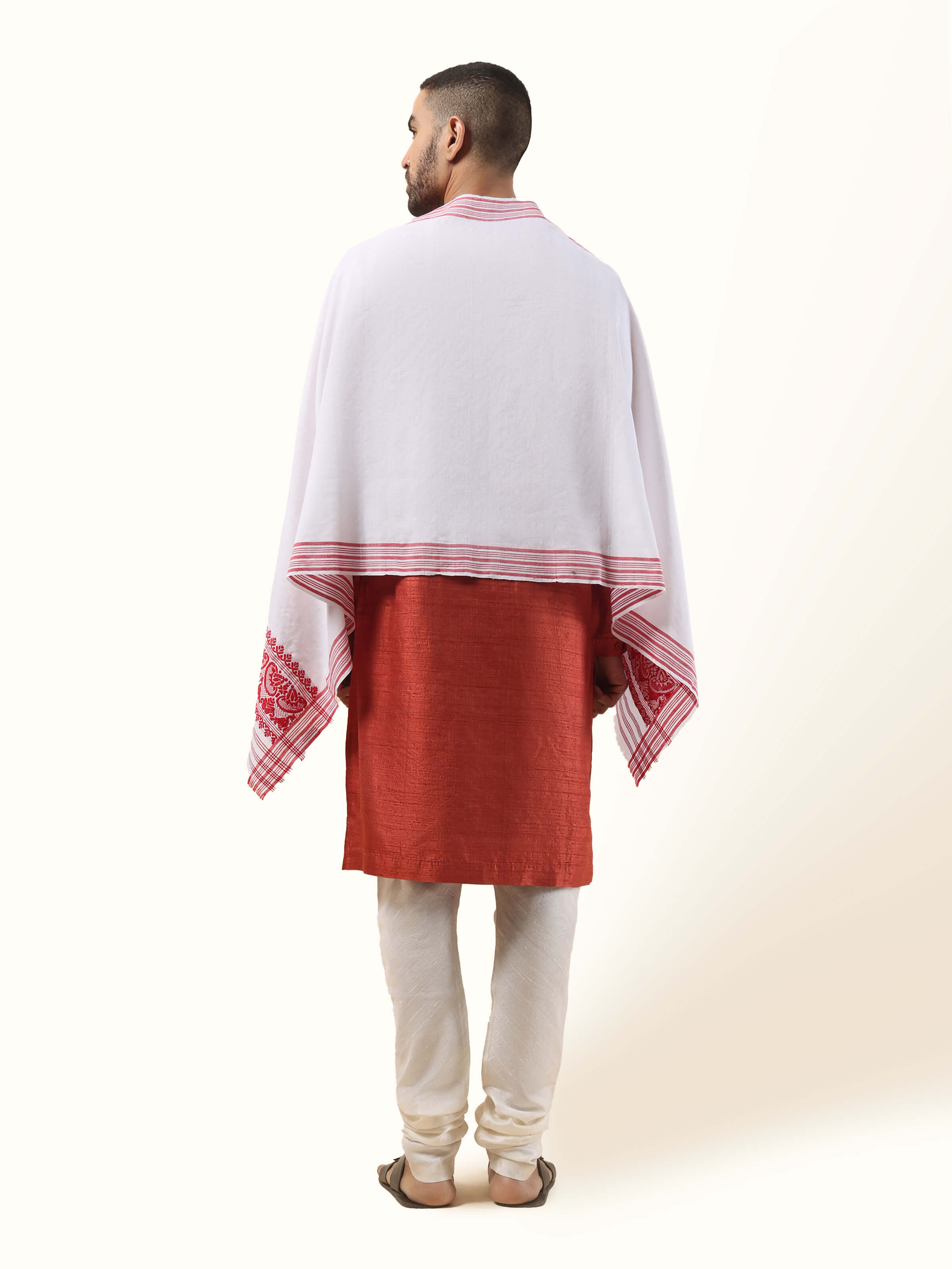 Back view of white stole draped simply over shoulders with clean lines.