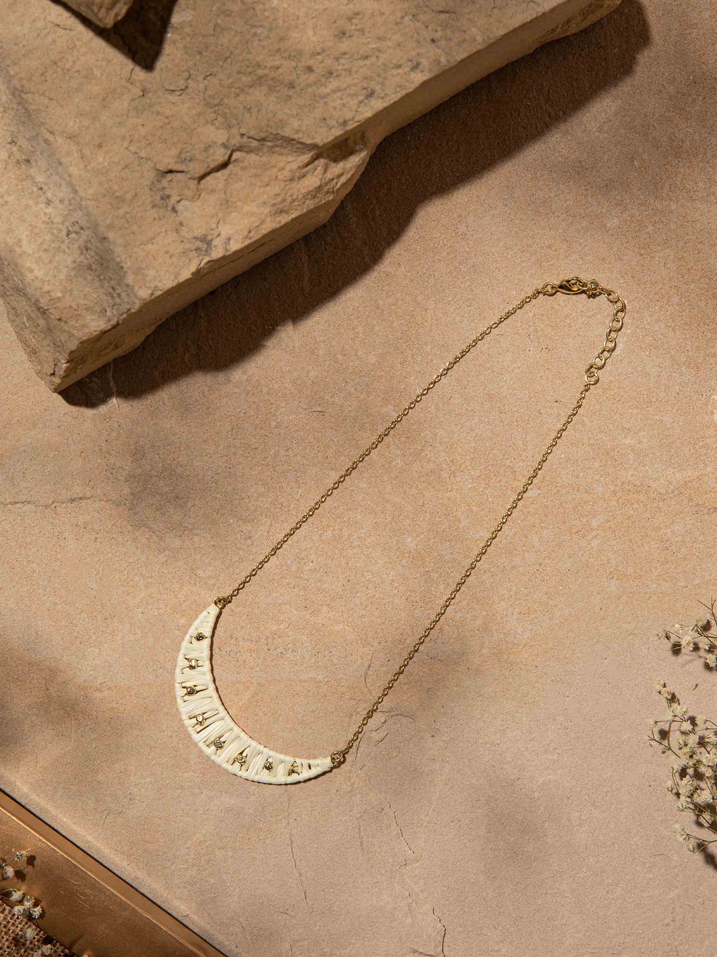 Close-up view of Raffia fibre long necklace emphasizing natural fibres and intricate details