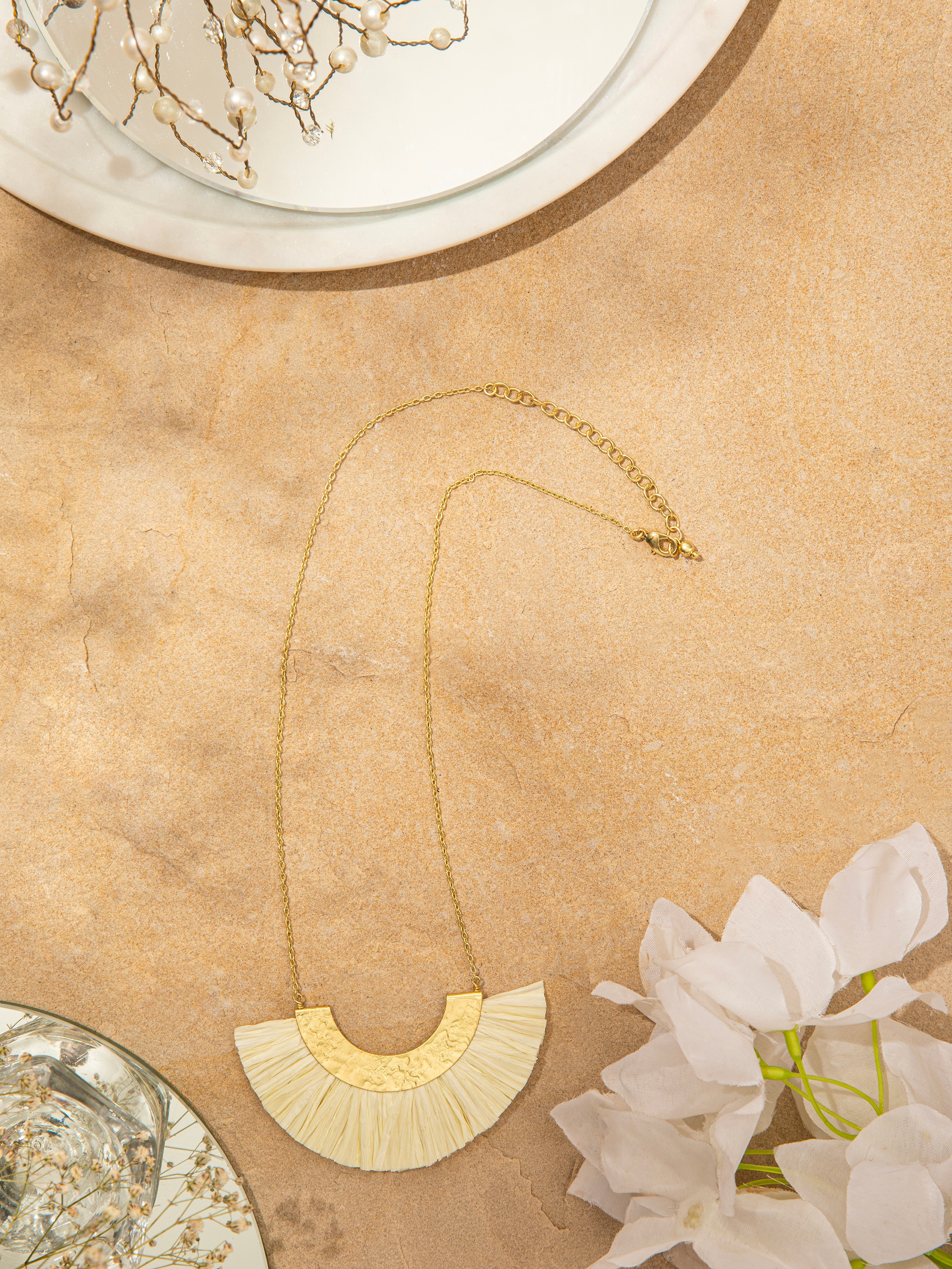 Close-up of Raffia Fibre Long Necklace showcasing the texture and quality of the fibre.