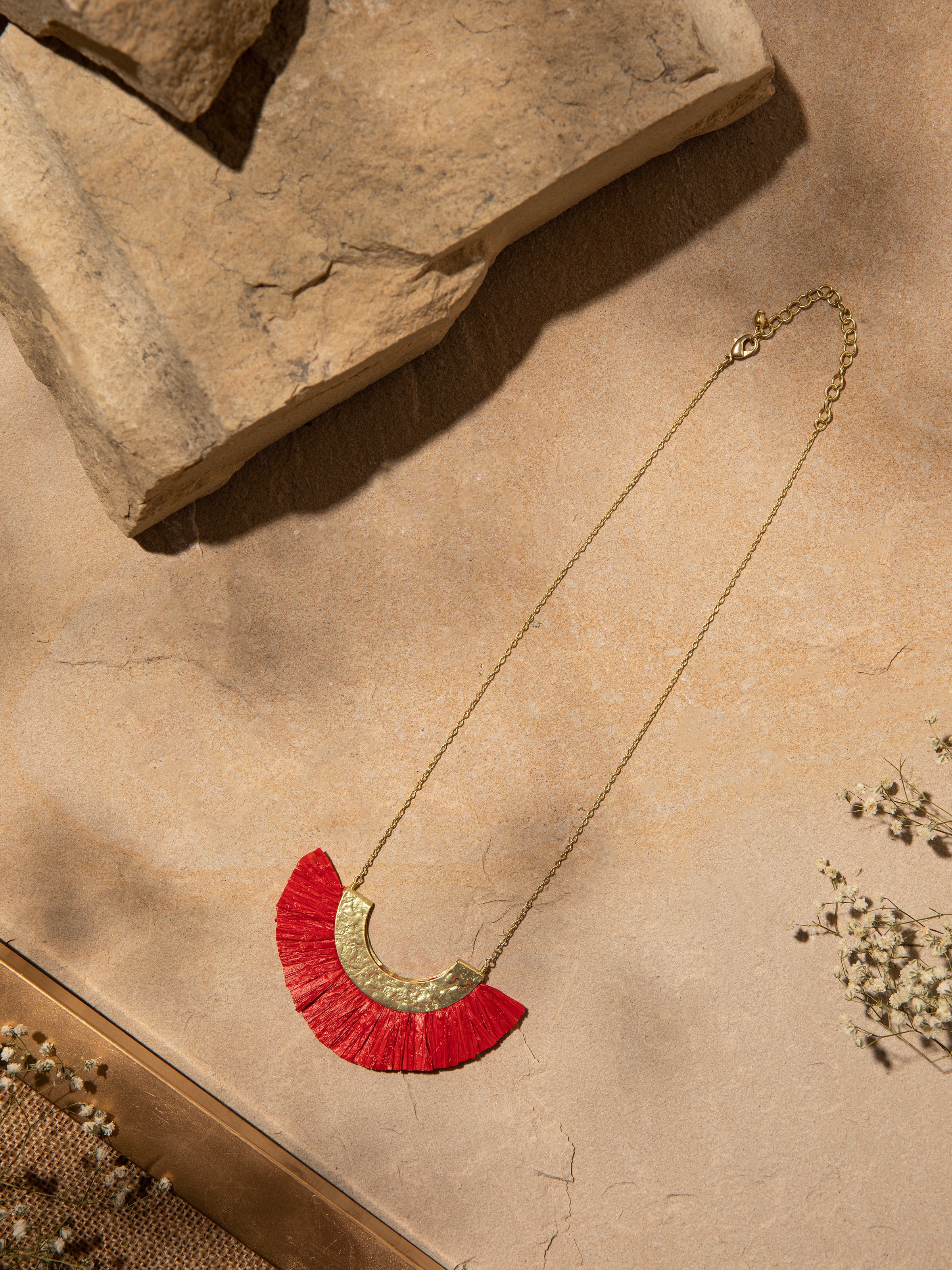 Close-up view of Raffia Fibre Long Necklace showing the texture and craftsmanship of the raffia fibres.