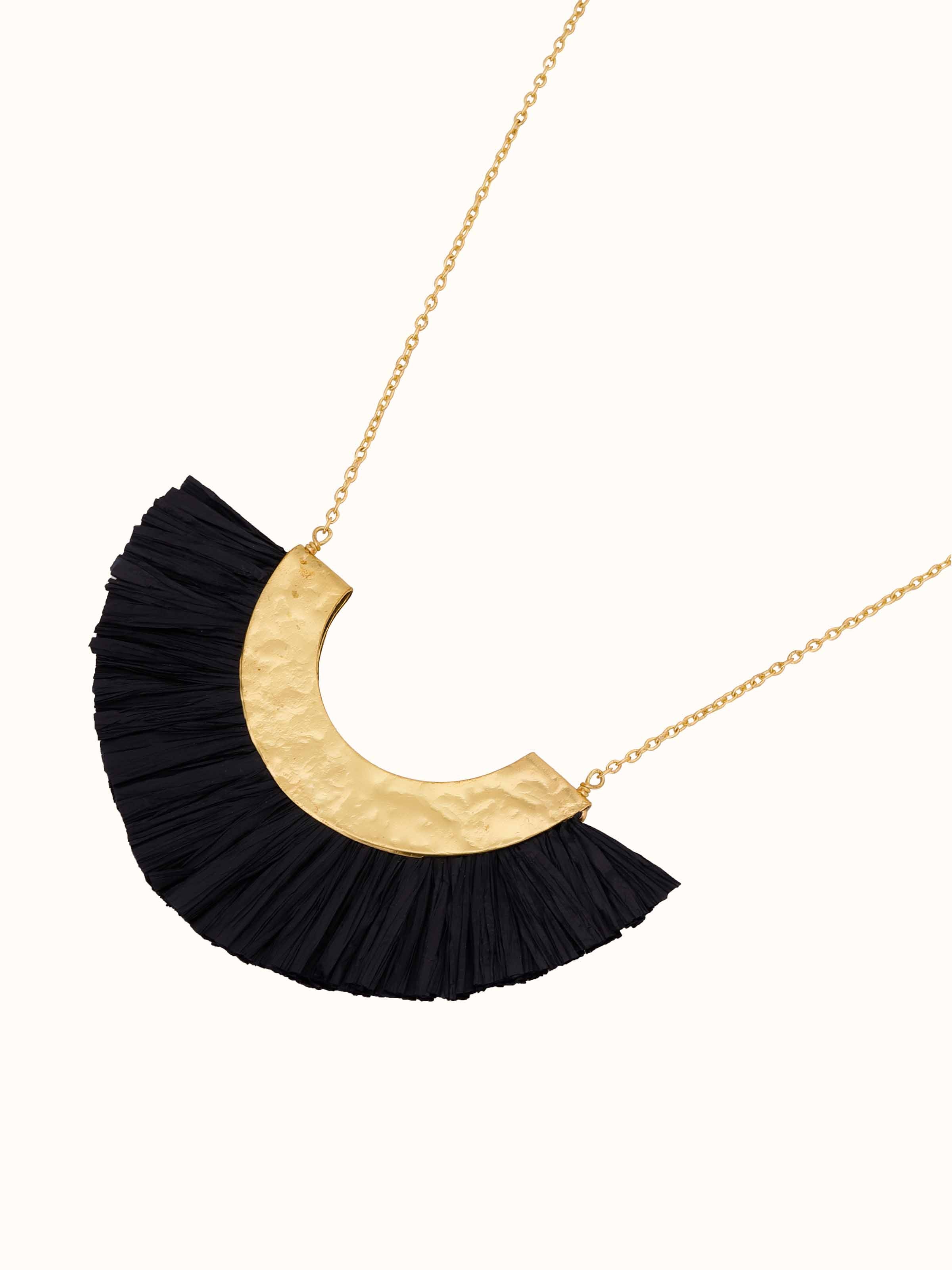 Angled view of Raffia Fibre Long Necklace emphasizing unique raffia texture and design.