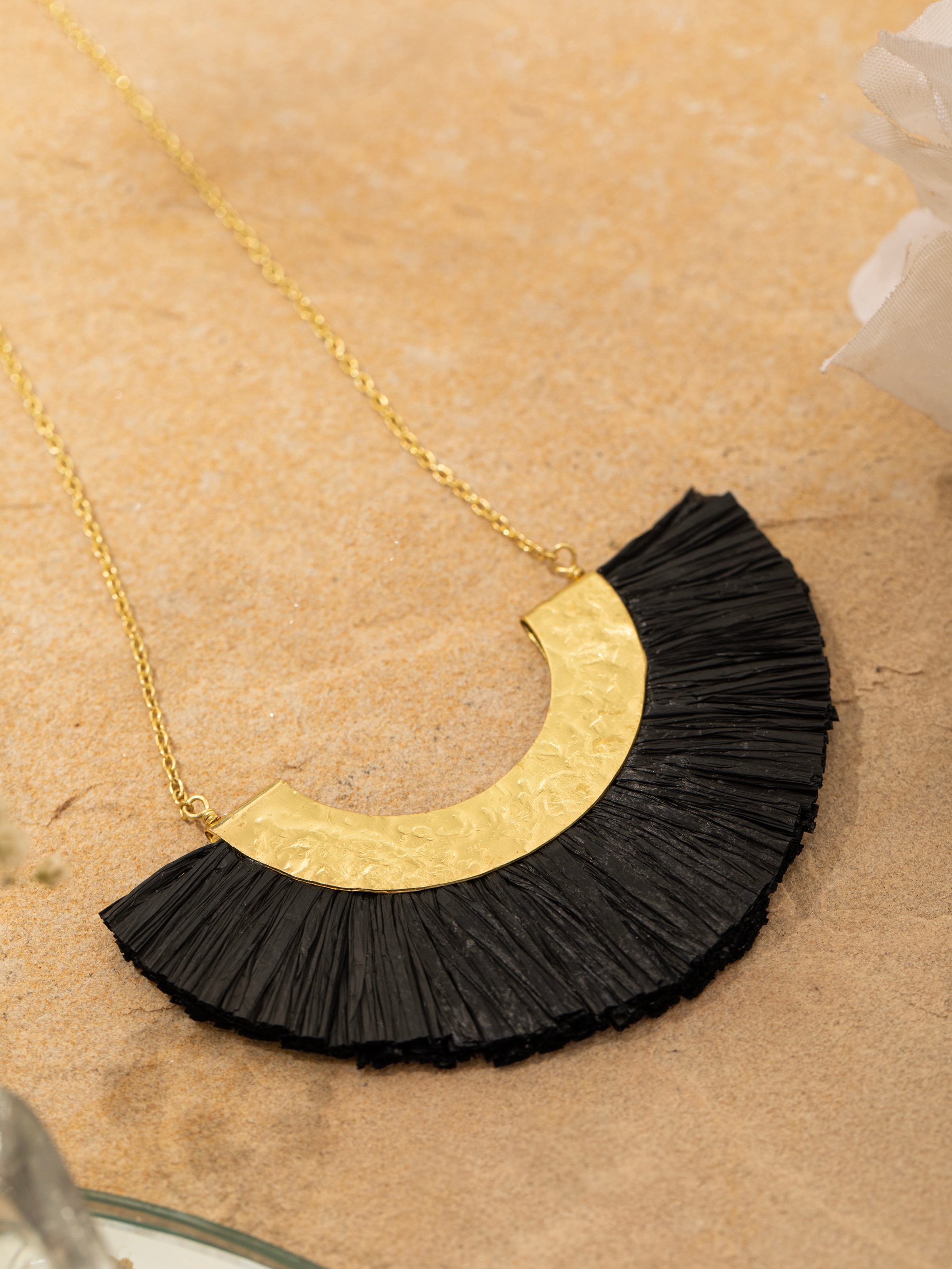 Detailed view of Raffia Fibre Long Necklace focusing on intricate fiber design and style.
