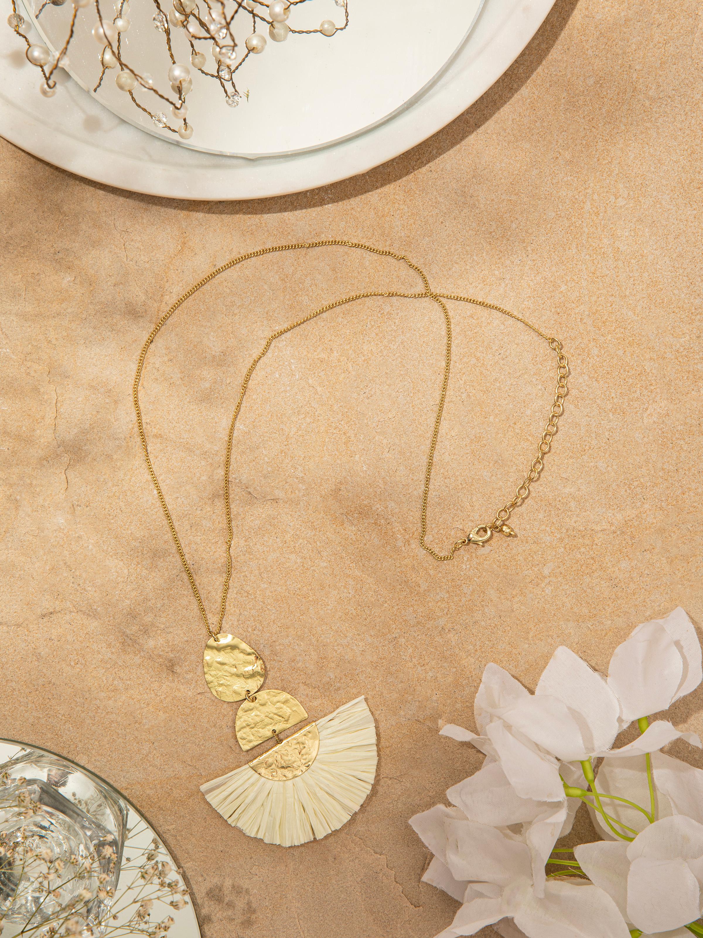 Side view of Raffia Fibre Long Necklace highlighting the intricate raffia detailing and necklace length.