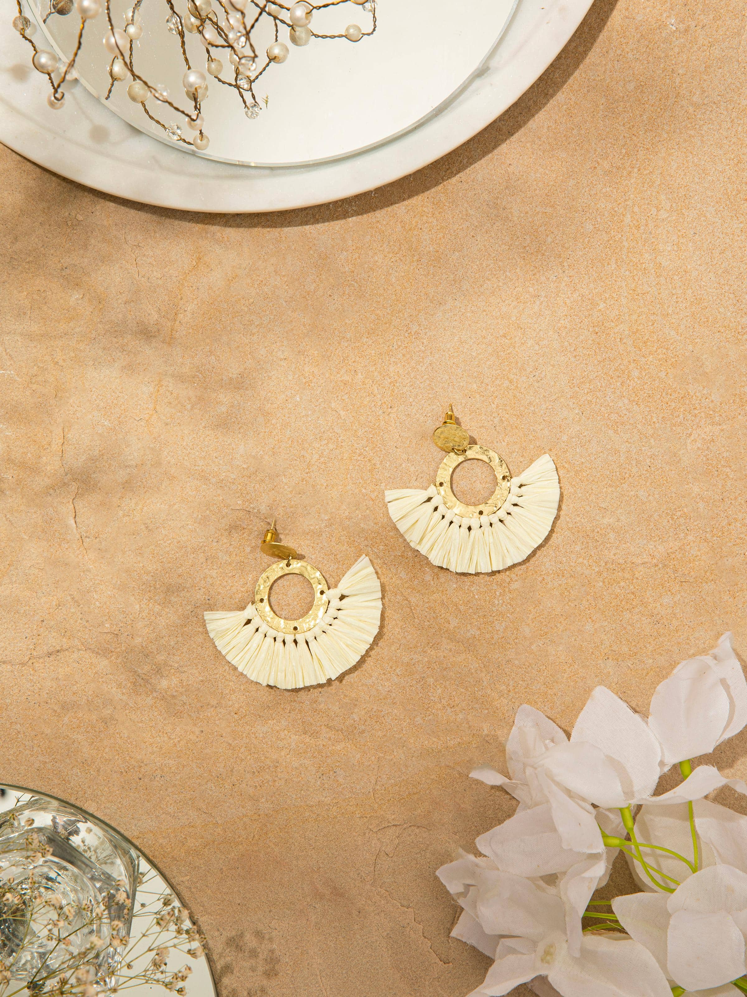 Side view of Raffia Fibre Drop Earrings highlighting the unique texture and design.