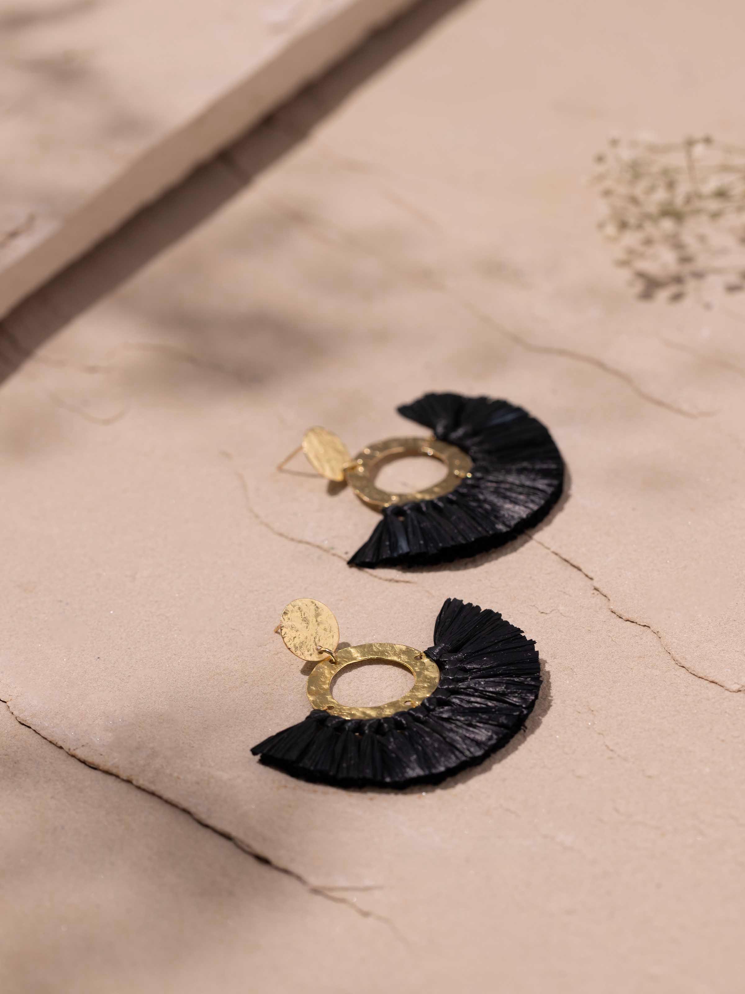 Detailed image of Raffia Fibre Drop Earrings focusing on the texture and craftsmanship of the raffia fibers.