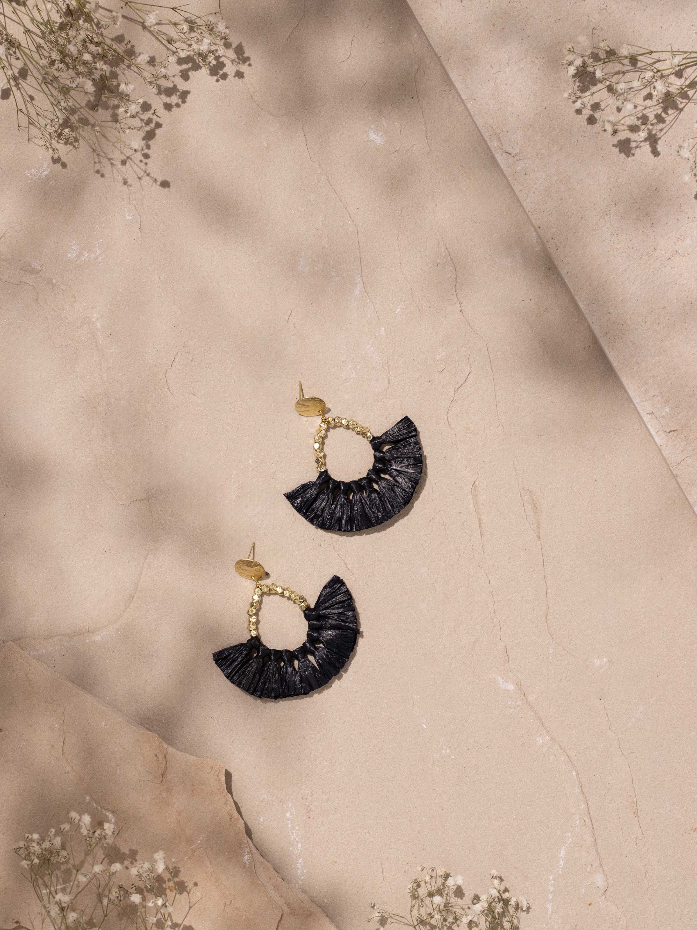 Side view of Raffia Fibre Drop Earrings displaying the full length and unique texture of the fibre.