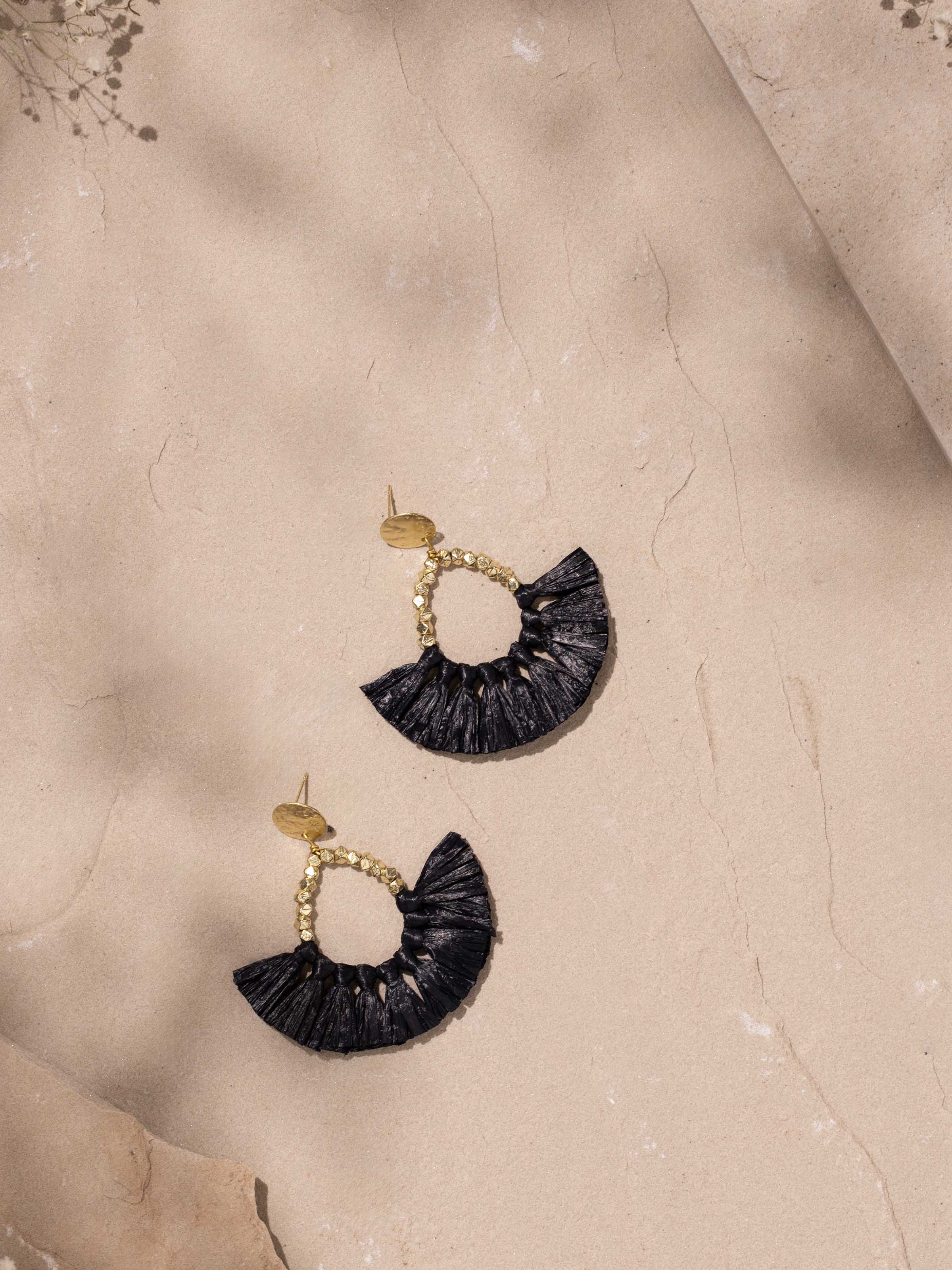 Detailed view of Raffia Fibre Drop Earrings focusing on the texture and craftsmanship of the fibre.