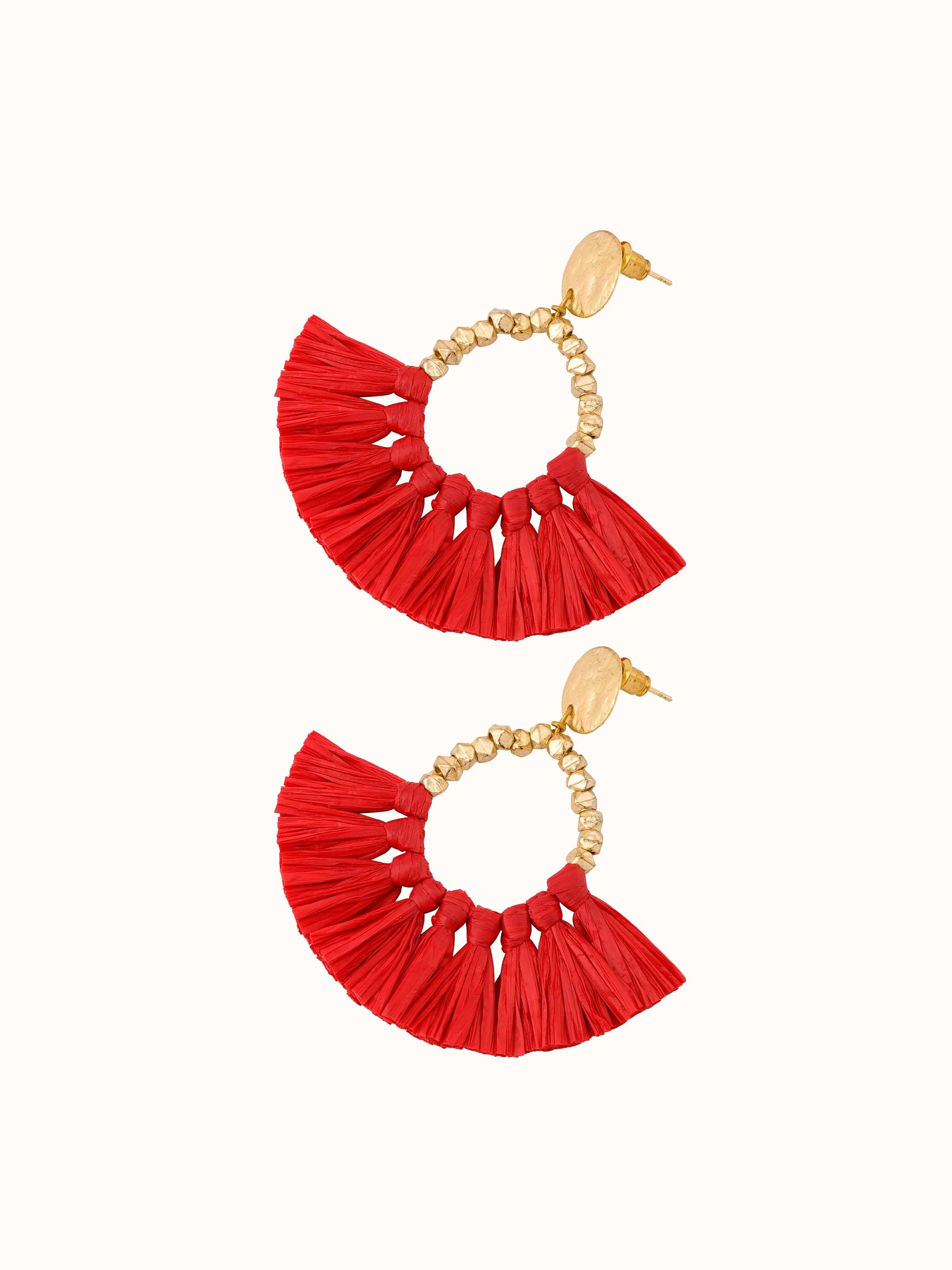 Angled view of Raffia fibre drop earrings with elegant design and natural look