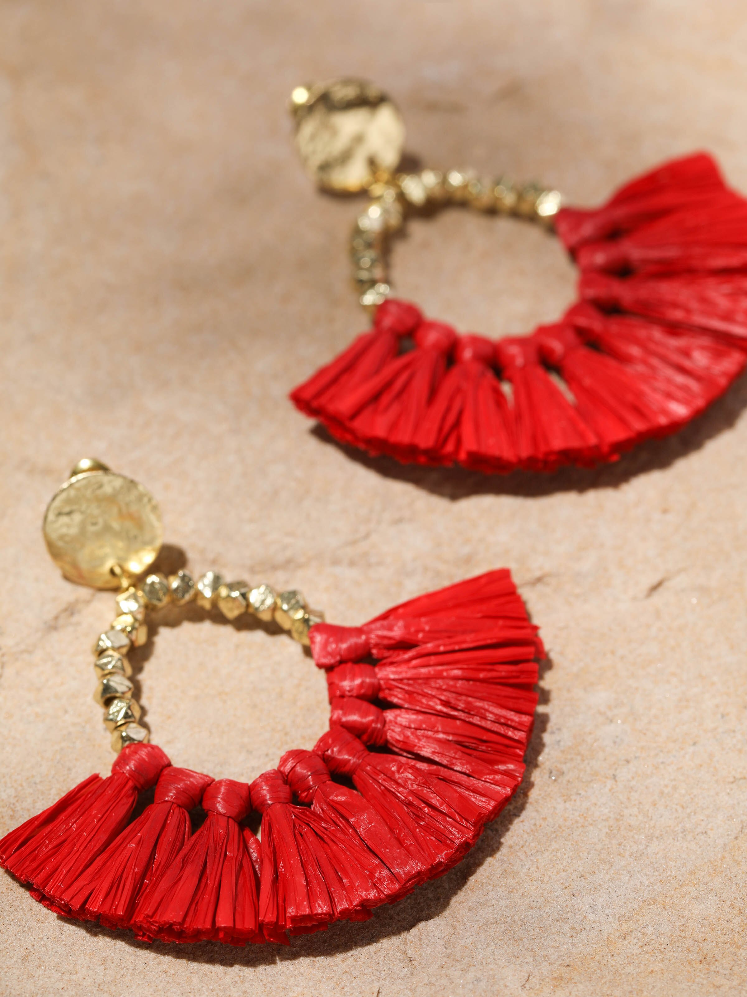 Detailed front view of Raffia fibre drop earrings highlighting their unique style
