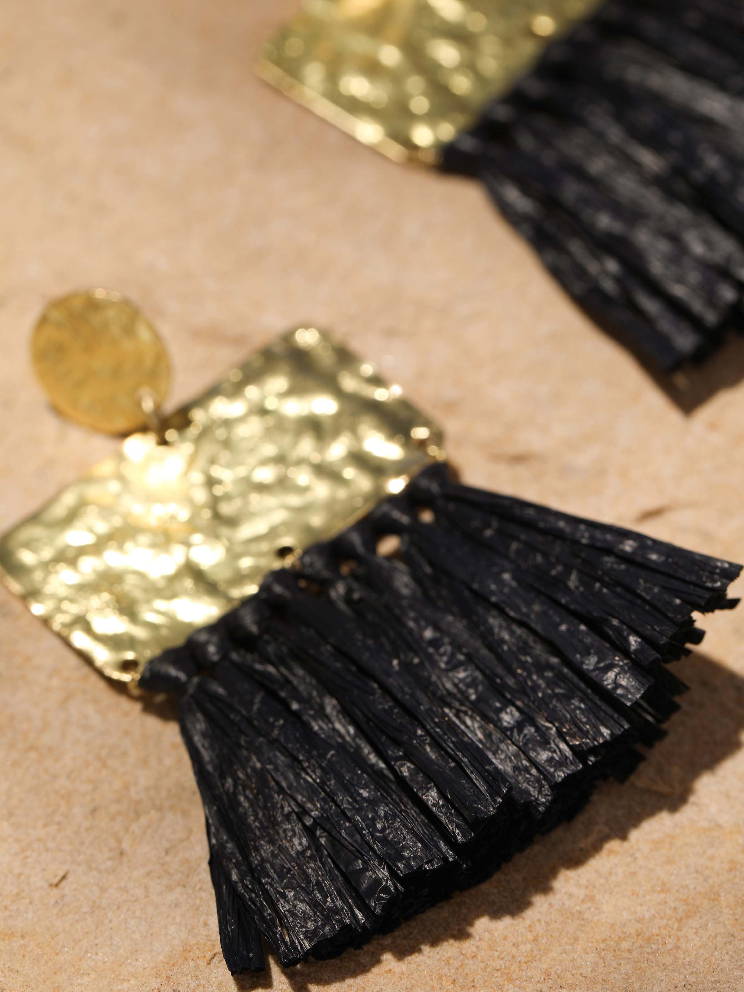 Detailed image of Raffia Fibre Drop Earrings focusing on the natural fibre texture and unique design.