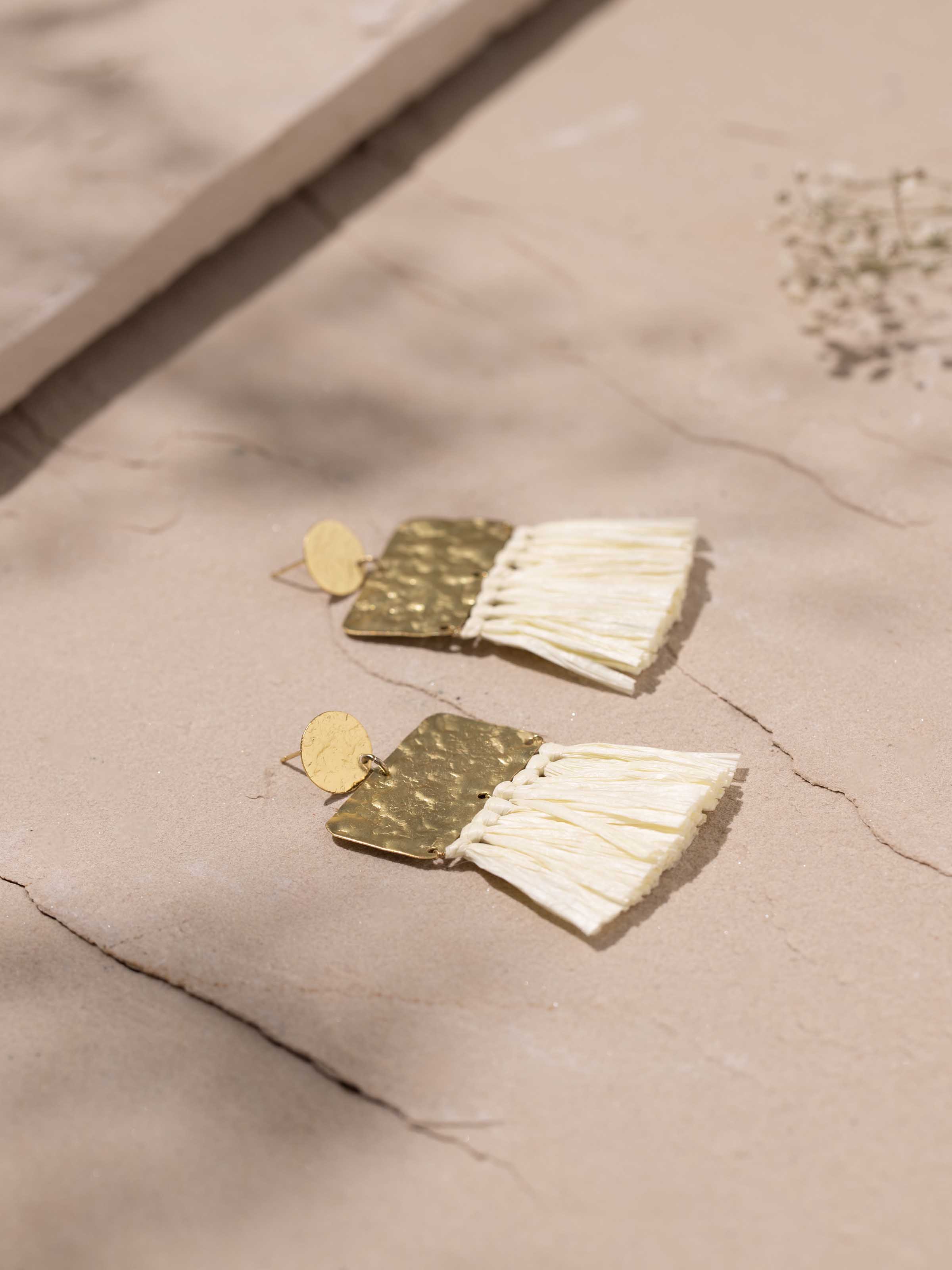 Detailed view of Raffia Fibre Drop Earrings highlighting the texture and craftsmanship of the fibre material.