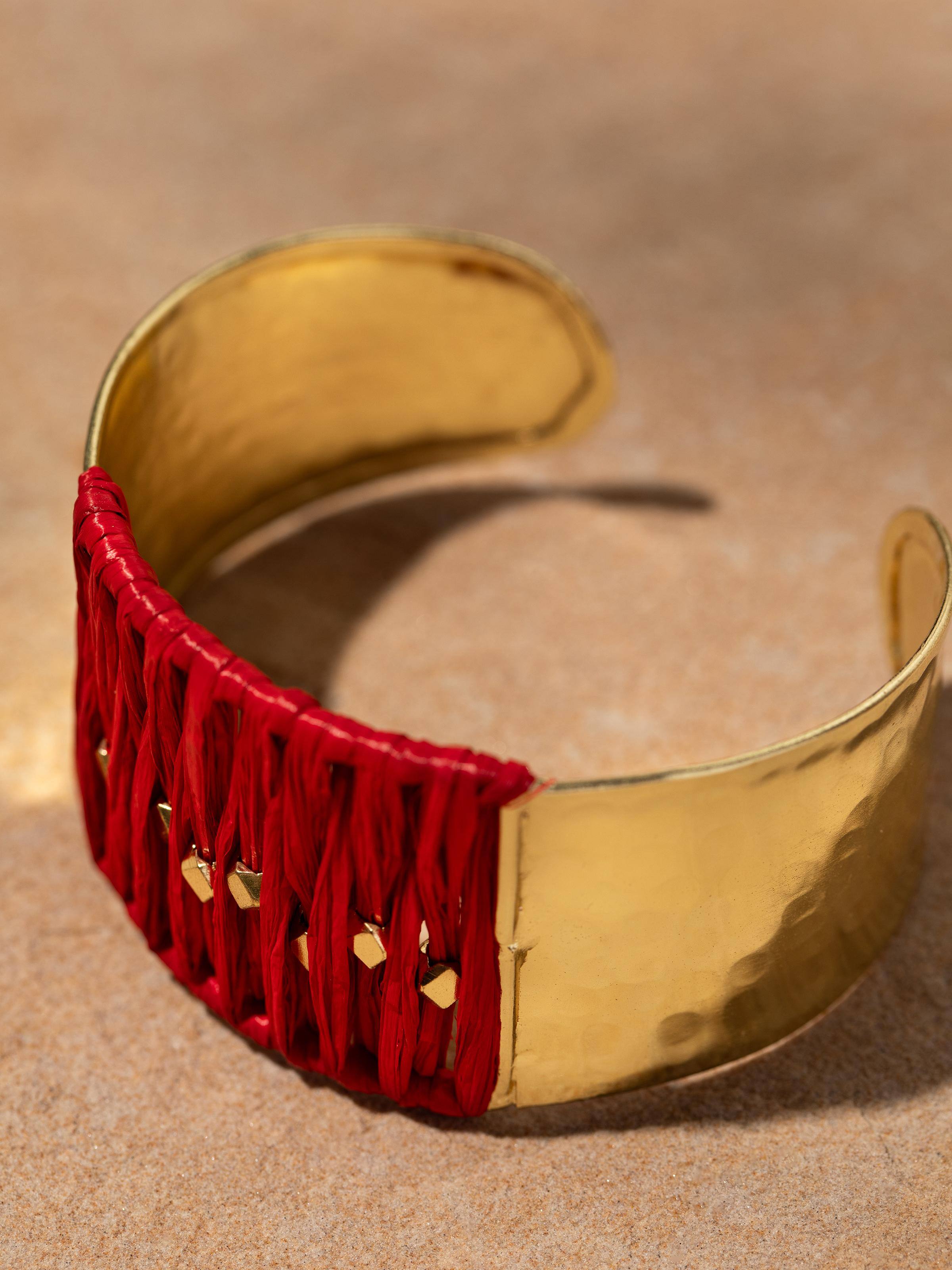 Detail shot showcasing the woven raffia pattern and earthy, handcrafted appeal of the Raffia Fibre Hand Cuff.