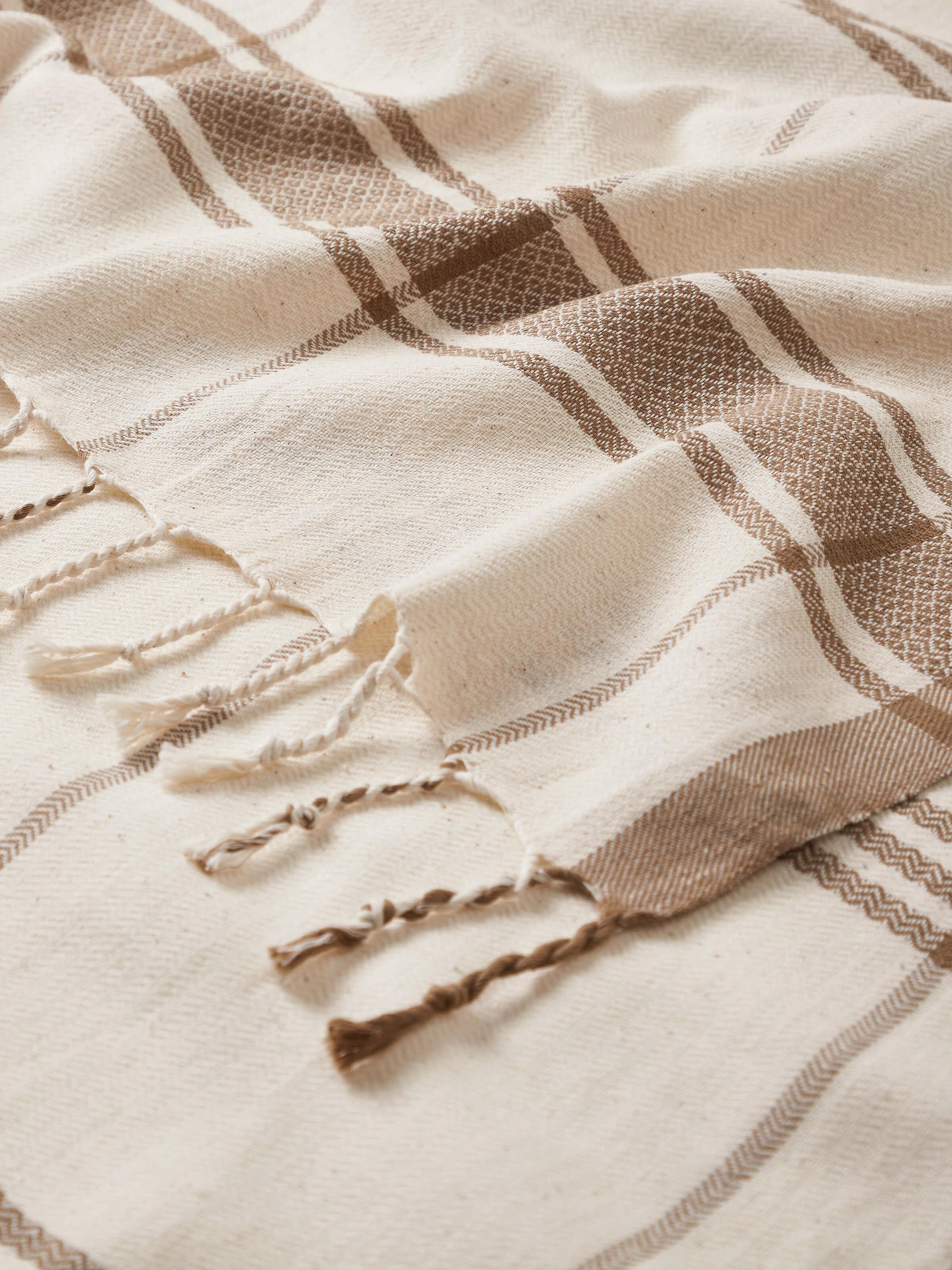 Detailed view of Sarvika Brown Checks Cotton Bath Towel (L), showcasing the texture and checkered design.